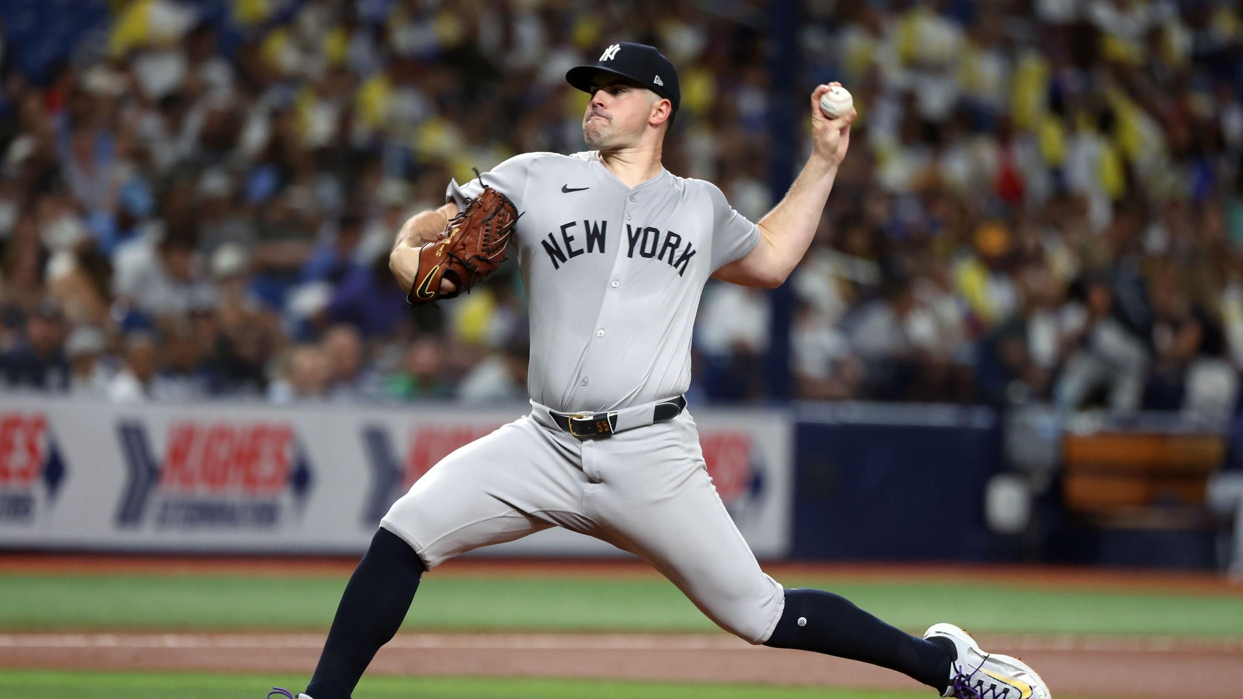 Jul 9, 2024; St. Petersburg, Florida, USA; New York Yankees starting pitcher Carlos Rodon (55) throws a pitch against the Tampa Bay Rays during the first inning at Tropicana Field.