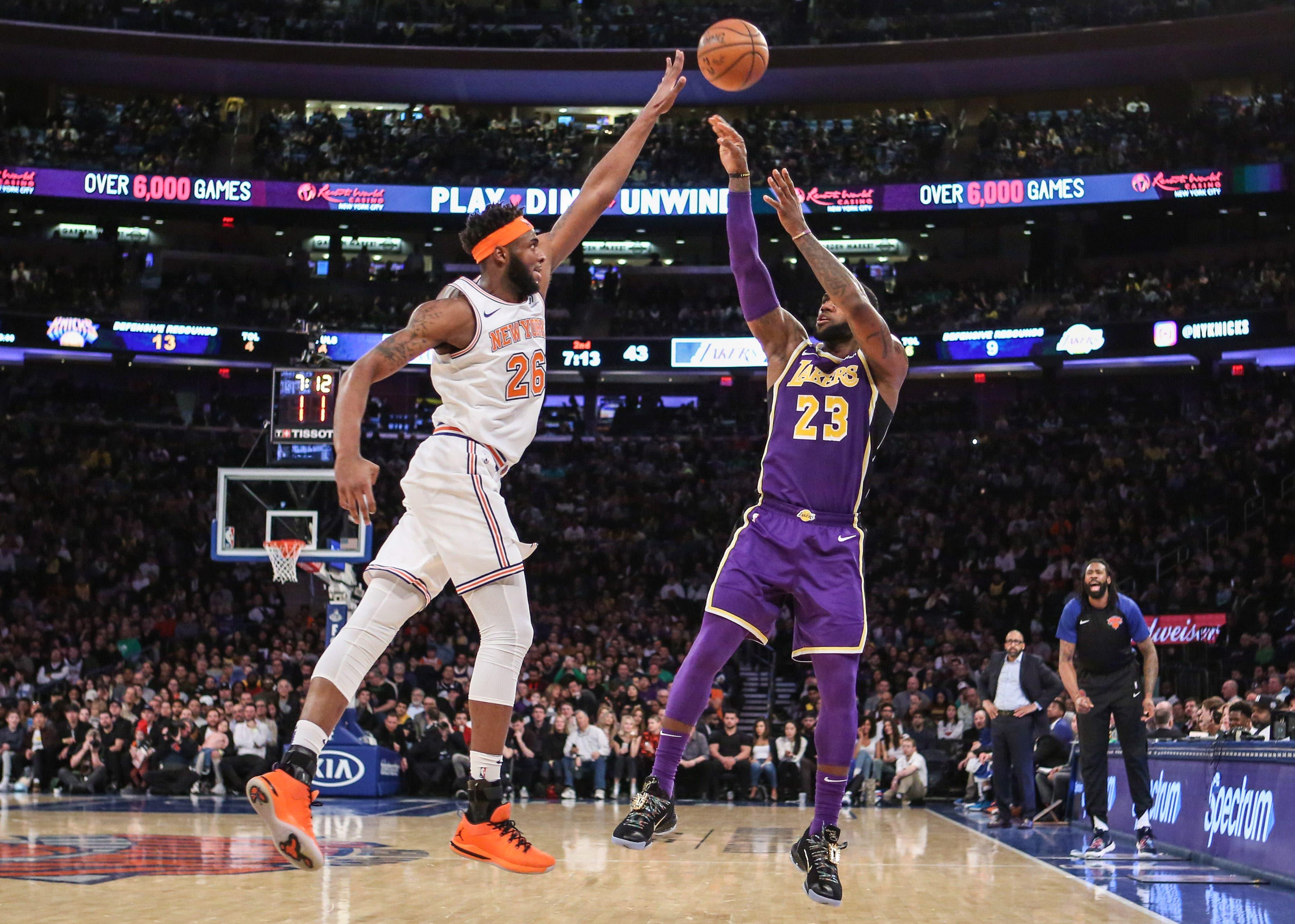 Mar 17, 2019; New York, NY, USA; New York Knicks center Mitchell Robinson (26) and Los Angeles Lakers forward LeBron James (23) at Madison Square Garden. Mandatory Credit: Wendell Cruz-USA TODAY Sports / Wendell Cruz