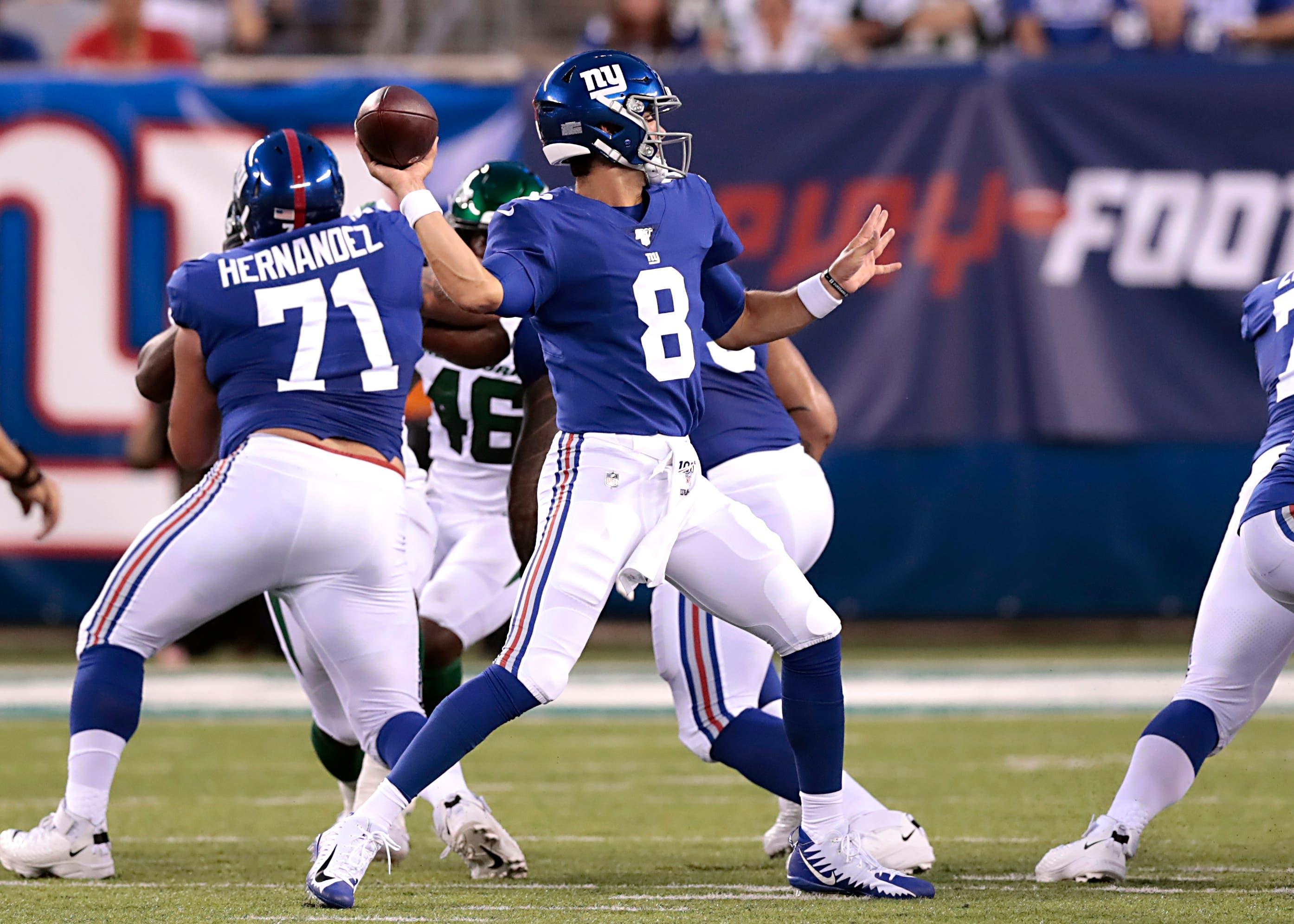 Aug 8, 2019; East Rutherford, NJ, USA; New York Giants quarterback Daniel Jones (8) throws the ball in front of offensive guard Will Hernandez (71) during the first half against the New York Jets at MetLife Stadium. Mandatory Credit: Vincent Carchietta-USA TODAY Sports / Vincent Carchietta