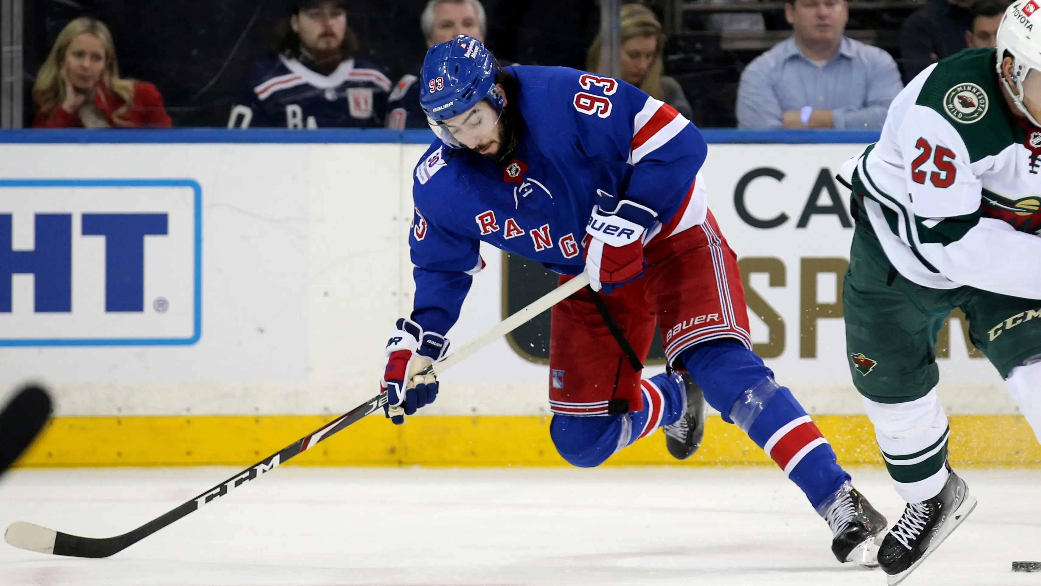 Jan 28, 2022; New York, New York, USA; New York Rangers center Mika Zibanejad (93) and Minnesota Wild defenseman Jonas Brodin (25) fight for a puck during the third period at Madison Square Garden. Mandatory Credit: Brad Penner-USA TODAY Sports / © Brad Penner-USA TODAY Sports