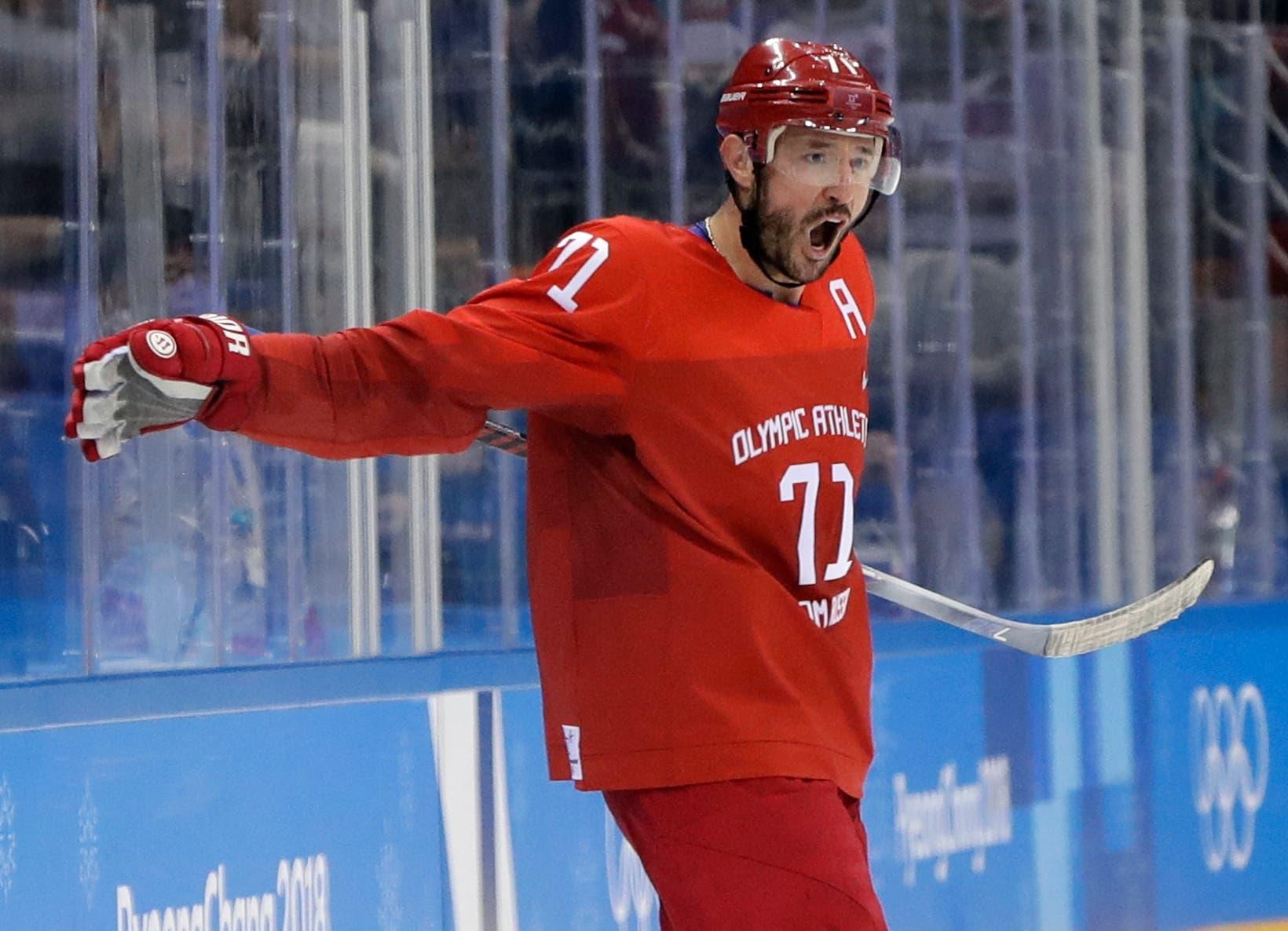 Russian athlete Ilya Kovalchuk (71) celebrates with Sergei Andronov (11) after scoring a goal during the second period of the preliminary round of the men's hockey game at the 2018 Winter Olympics in Gangneung, South Korea, Saturday, Feb. 17, 2018. (AP Photo/Matt Slocum) / Matt Slocum/AP