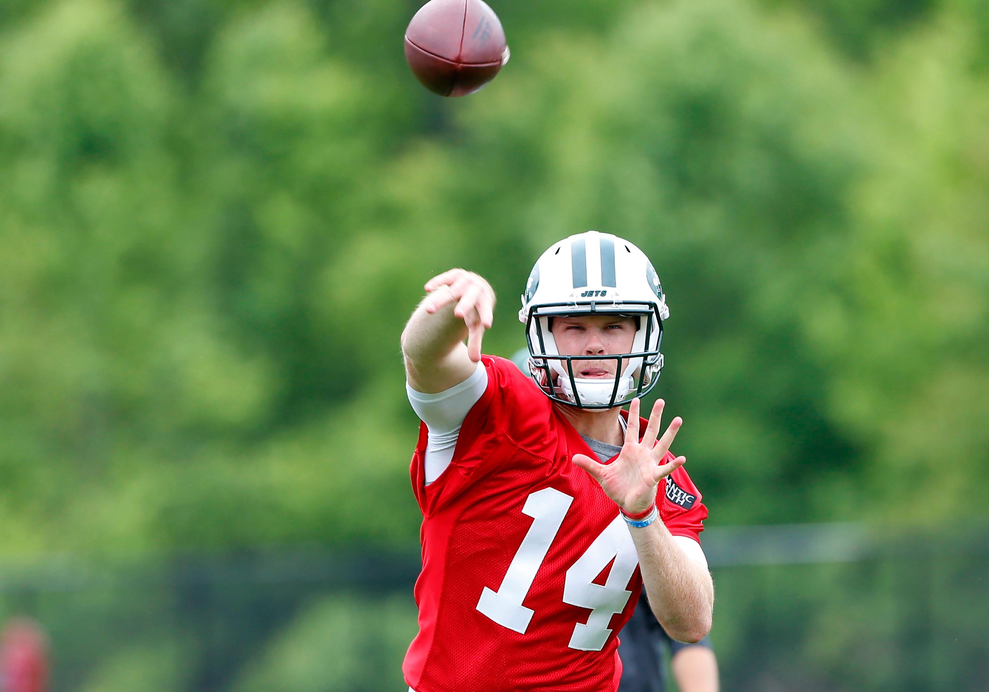 New York Jets quarterback Sam Darnold throws a pass during organized team activities at Atlantic Health Training Center.