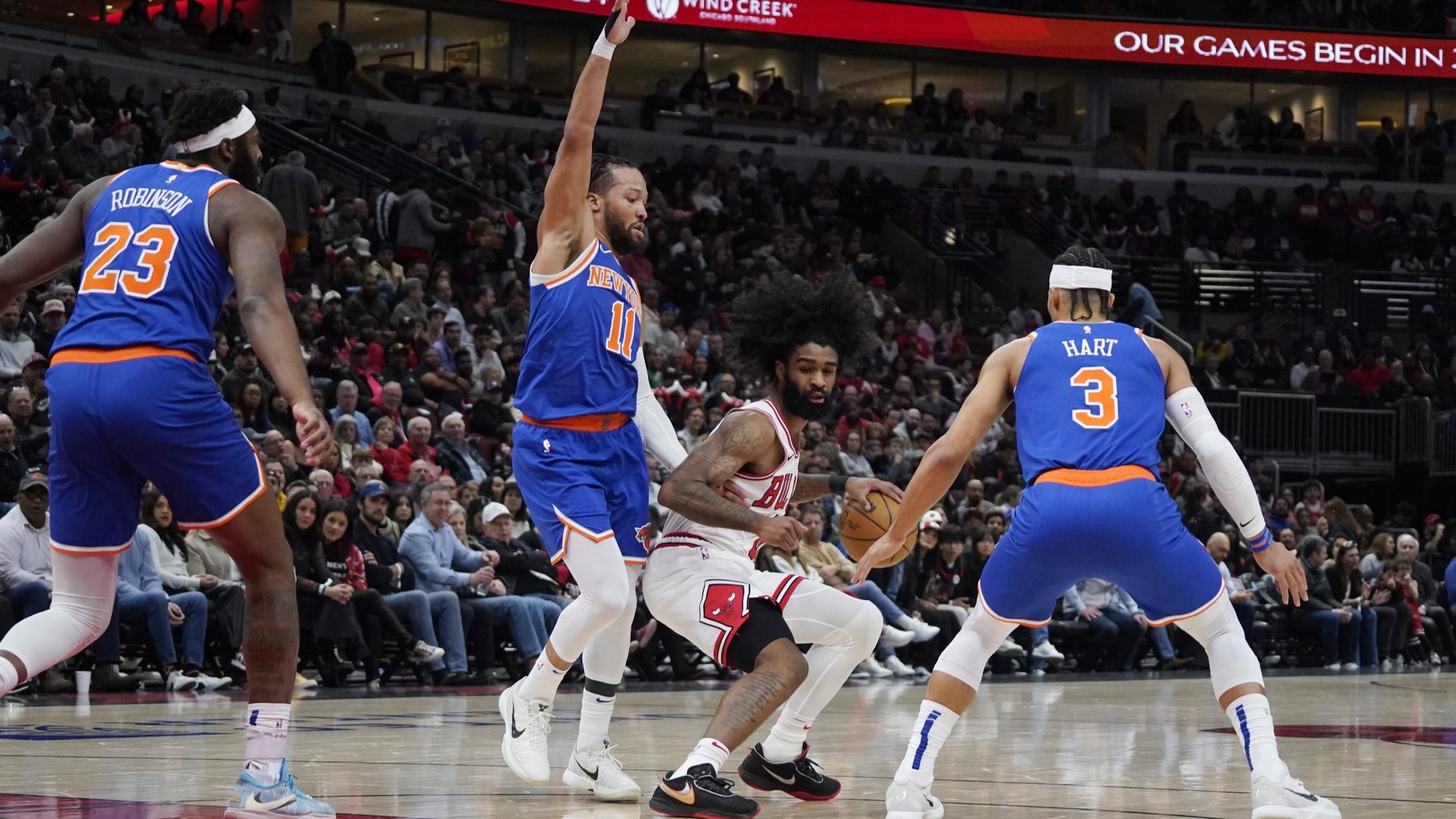 Apr 9, 2024; Chicago, Illinois, USA; New York Knicks guard Jalen Brunson (11) defends Chicago Bulls guard Coby White (0) during the first quarter at United Center. / David Banks-USA TODAY Sports