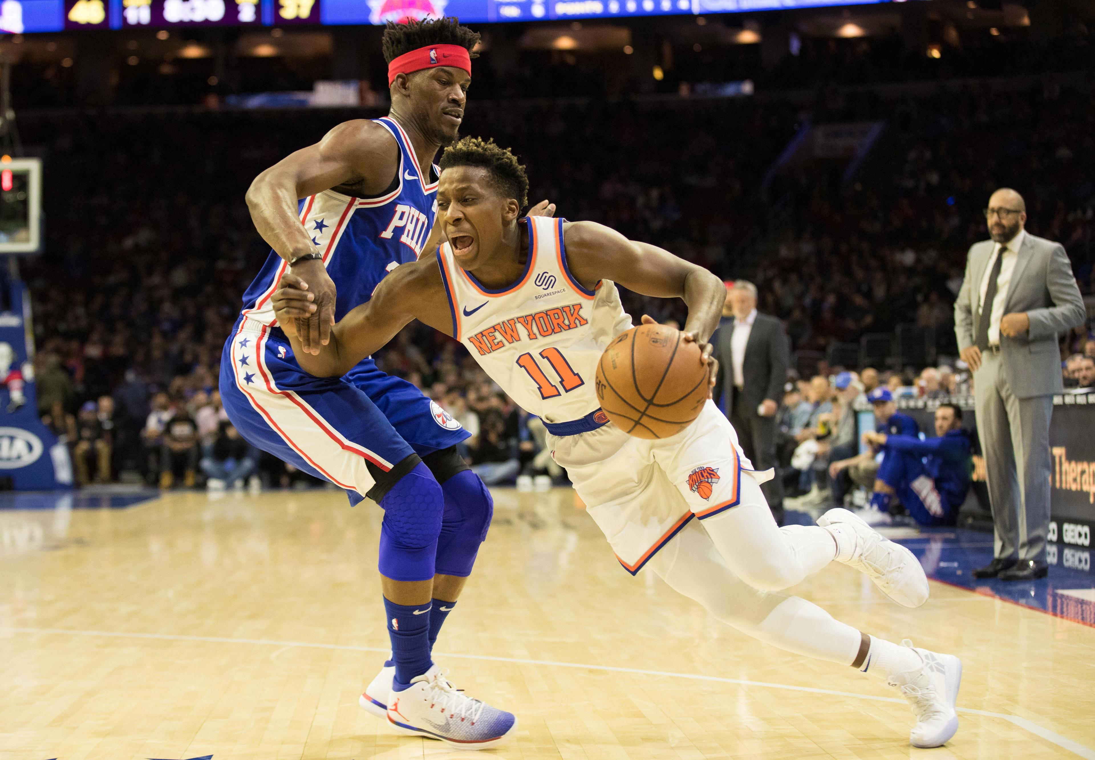 Dec 19, 2018; Philadelphia, PA, USA; New York Knicks guard Frank Ntilikina (11) drives to the basket against Philadelphia 76ers guard Jimmy Butler (23) during the second quarter at Wells Fargo Center. Mandatory Credit: Bill Streicher-USA TODAY Sports 