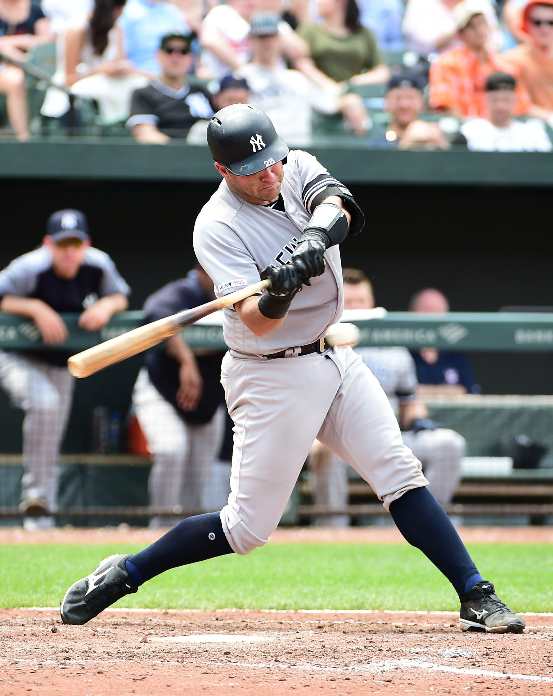 May 23, 2019; Baltimore, MD, USA; New York Yankees catcher Austin Romine (28) hits an RBI single in the seventh inning against the Baltimore Orioles at Oriole Park at Camden Yards. Mandatory Credit: Evan Habeeb-USA TODAY Sports / Evan Habeeb