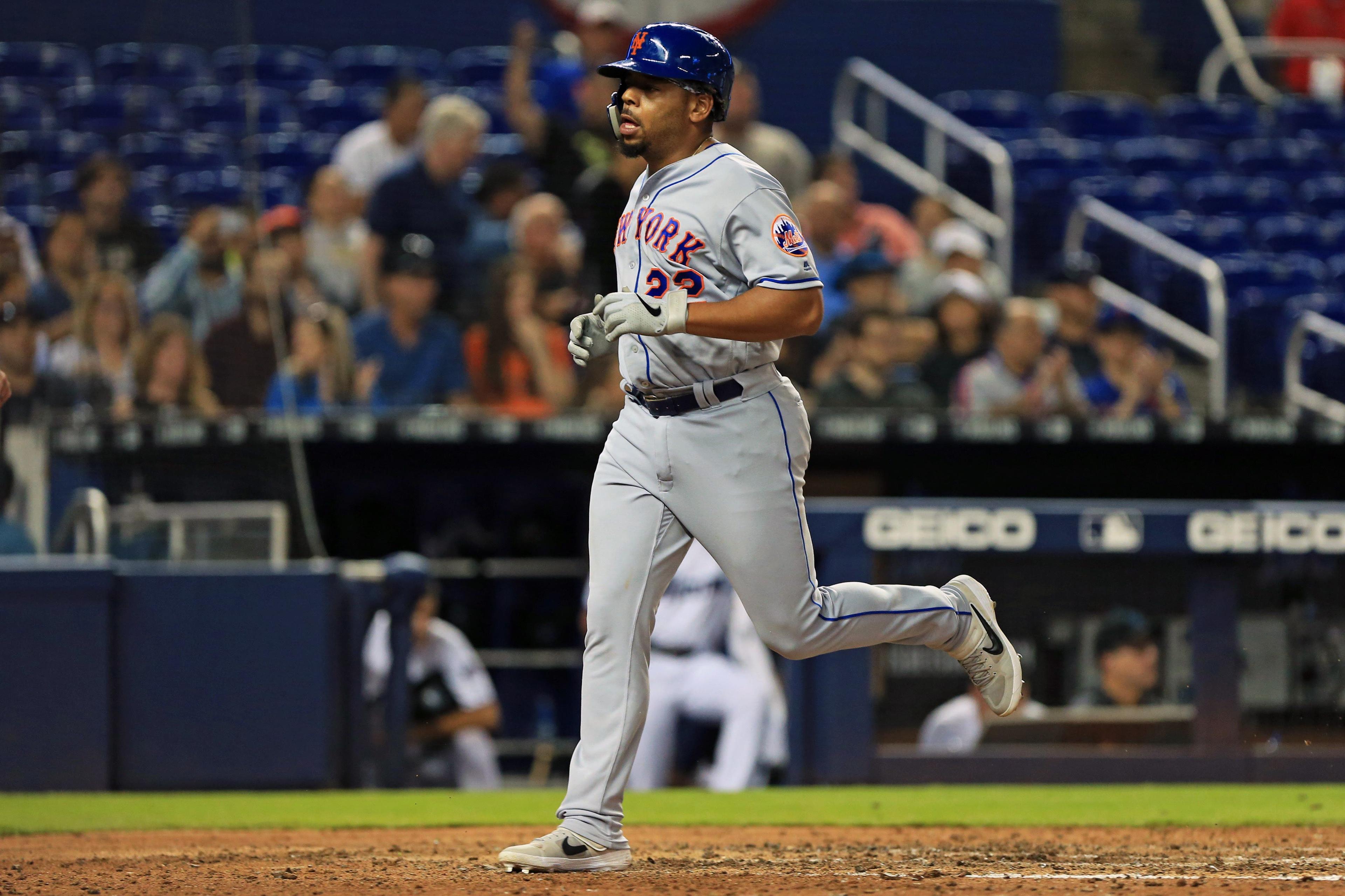 Apr 3, 2019; Miami, FL, USA; New York Mets first baseman Dominic Smith (22) scores on a single by catcher Wilson Ramos (not pictured) in the eight inning against the Miami Marlins at Marlins Park. Mandatory Credit: Sam Navarro-USA TODAY Sports / Sam Navarro