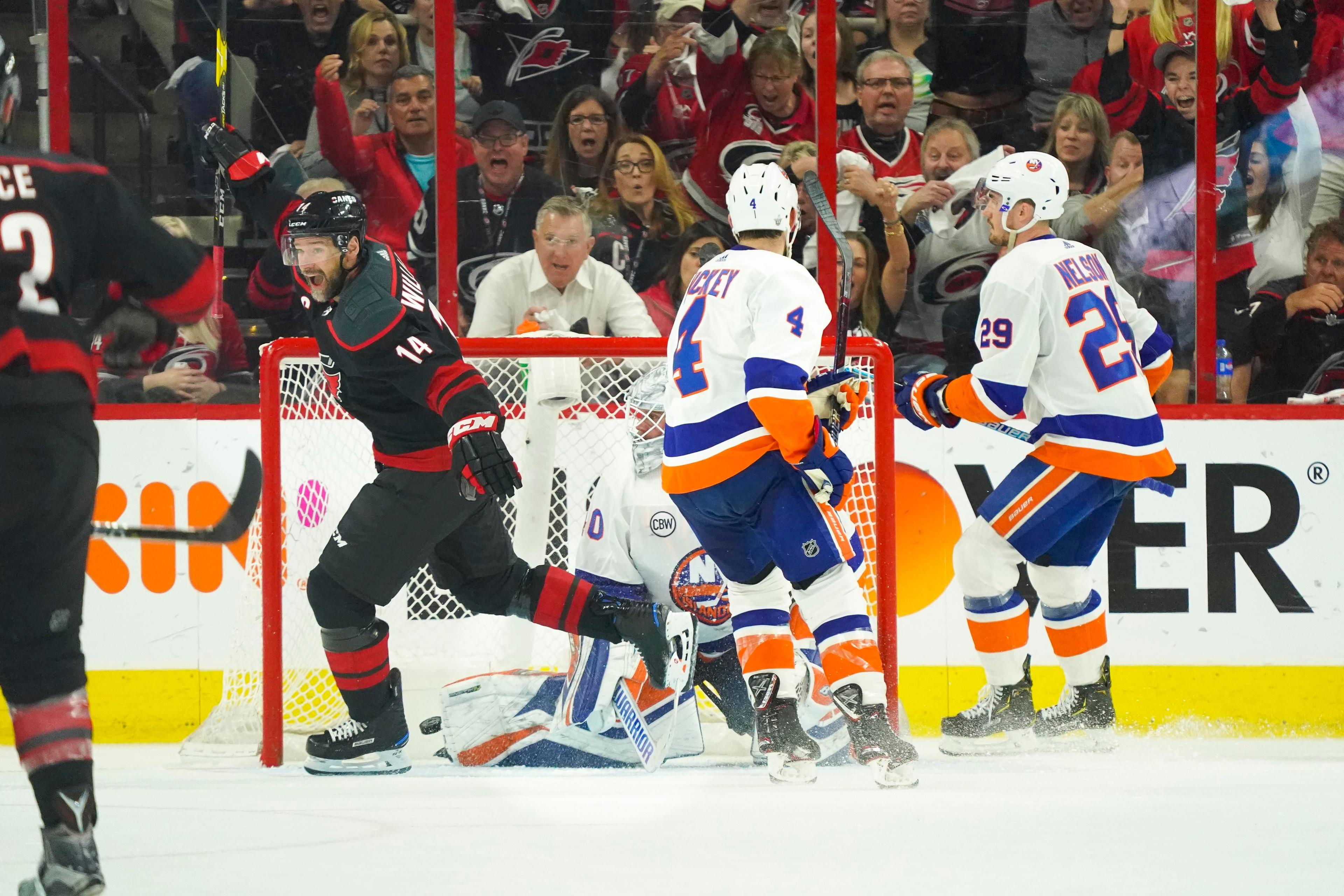 May 1, 2019; Raleigh, NC, USA; Carolina Hurricanes right wing Justin Williams (14) celebrates after a goal against the New York Islanders during the third period in game three of the second round of the 2019 Stanley Cup Playoffs at PNC Arena. Mandatory Credit: James Guillory-USA TODAY Sports 