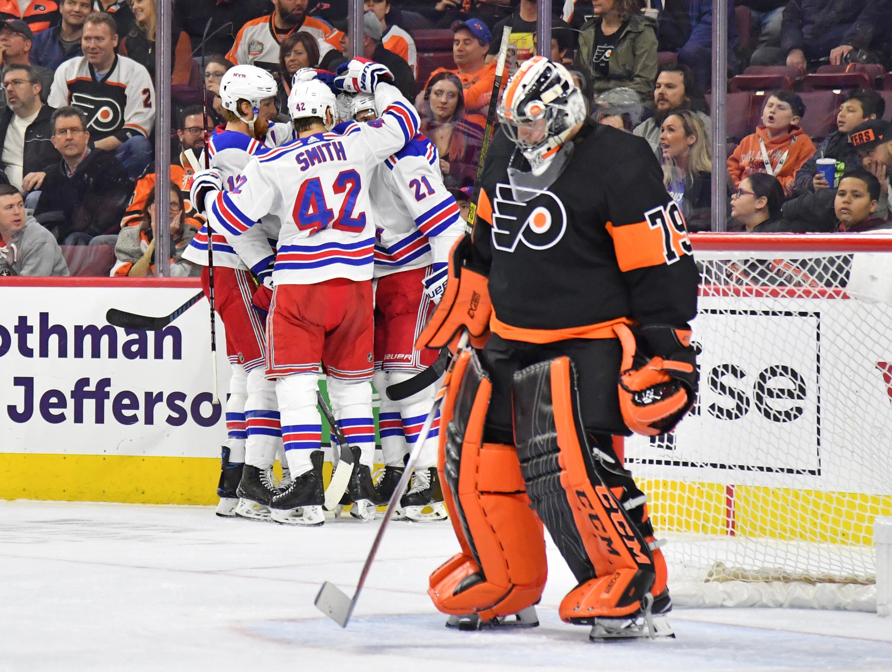 Mar 31, 2019; Philadelphia, PA, USA; New York Rangers celebrate after scoring a goal against Philadelphia Flyers goaltender Carter Hart (79) during the first period at Wells Fargo Center. Mandatory Credit: Eric Hartline-USA TODAY Sports