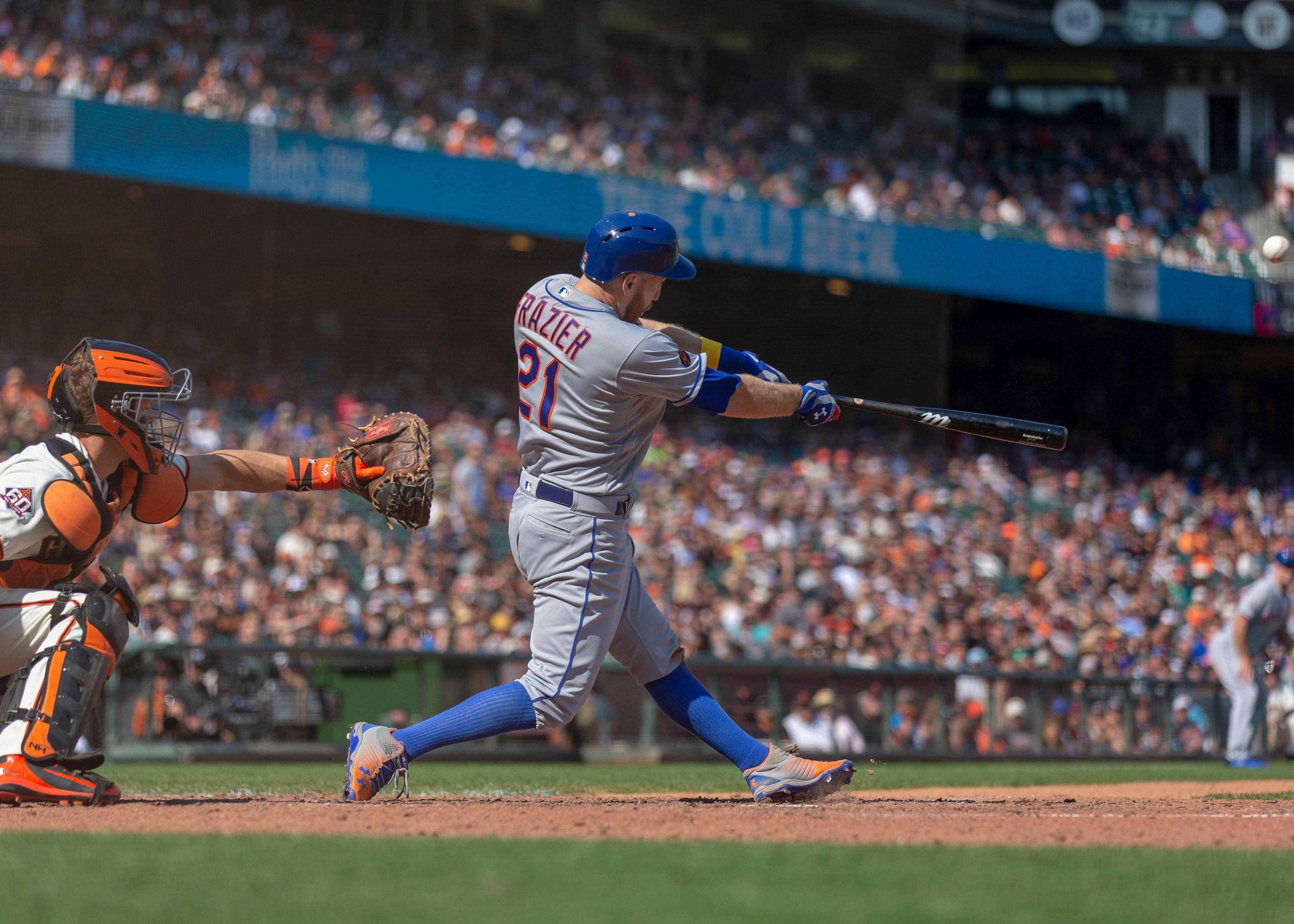 Sep 1, 2018; San Francisco, CA, USA; New York Mets third baseman Todd Frazier (21) hits a RBI fly ball during the eleventh inning against the San Francisco Giants at AT&T Park. Mandatory Credit: Neville E. Guard-USA TODAY Sports