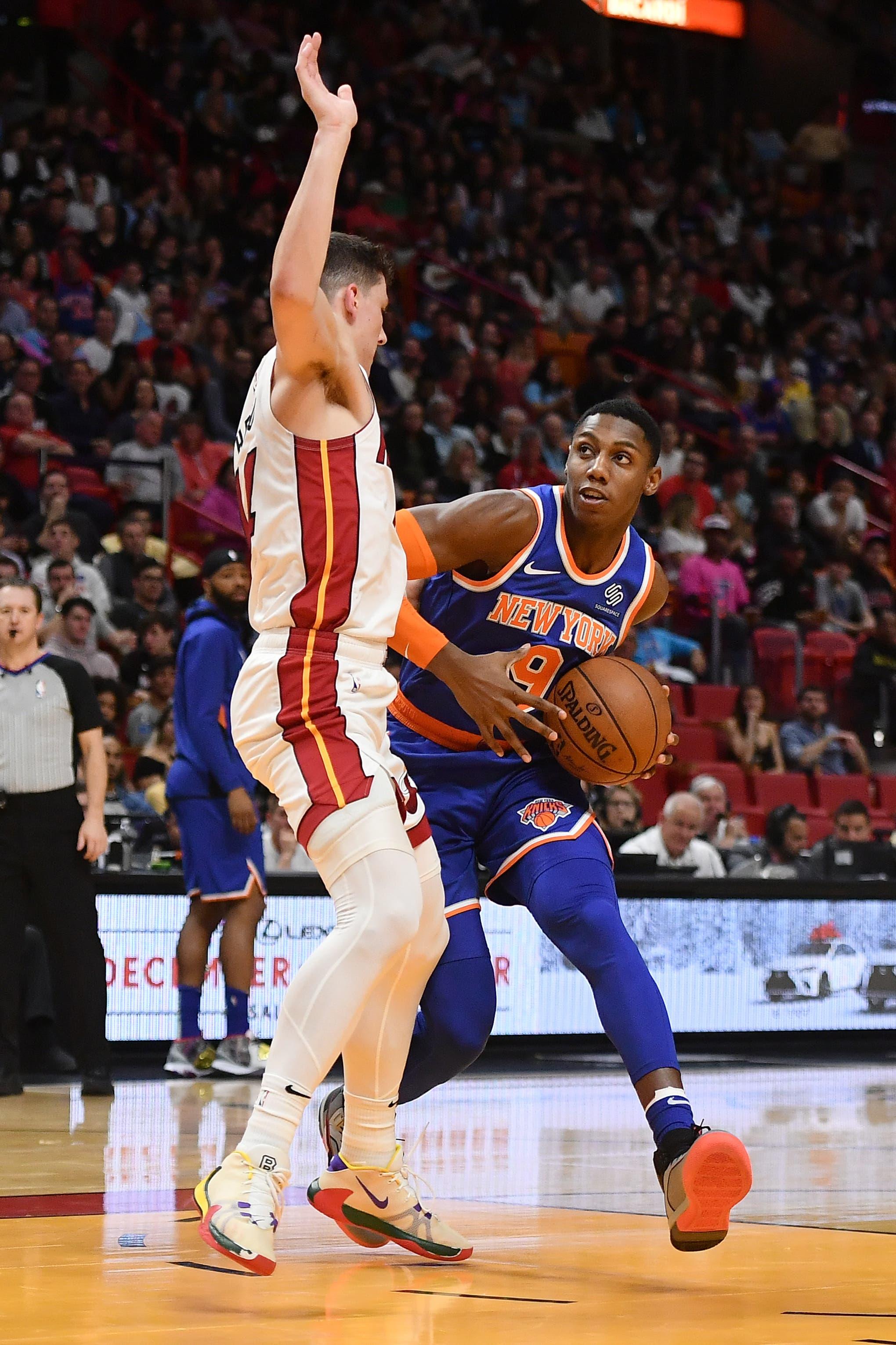 Dec 20, 2019; Miami, Florida, USA; New York Knicks forward RJ Barrett (9) drives the ball around Miami Heat guard Tyler Herro (14) during the first half at American Airlines Arena. Mandatory Credit: Jasen Vinlove-USA TODAY Sports / Jasen Vinlove