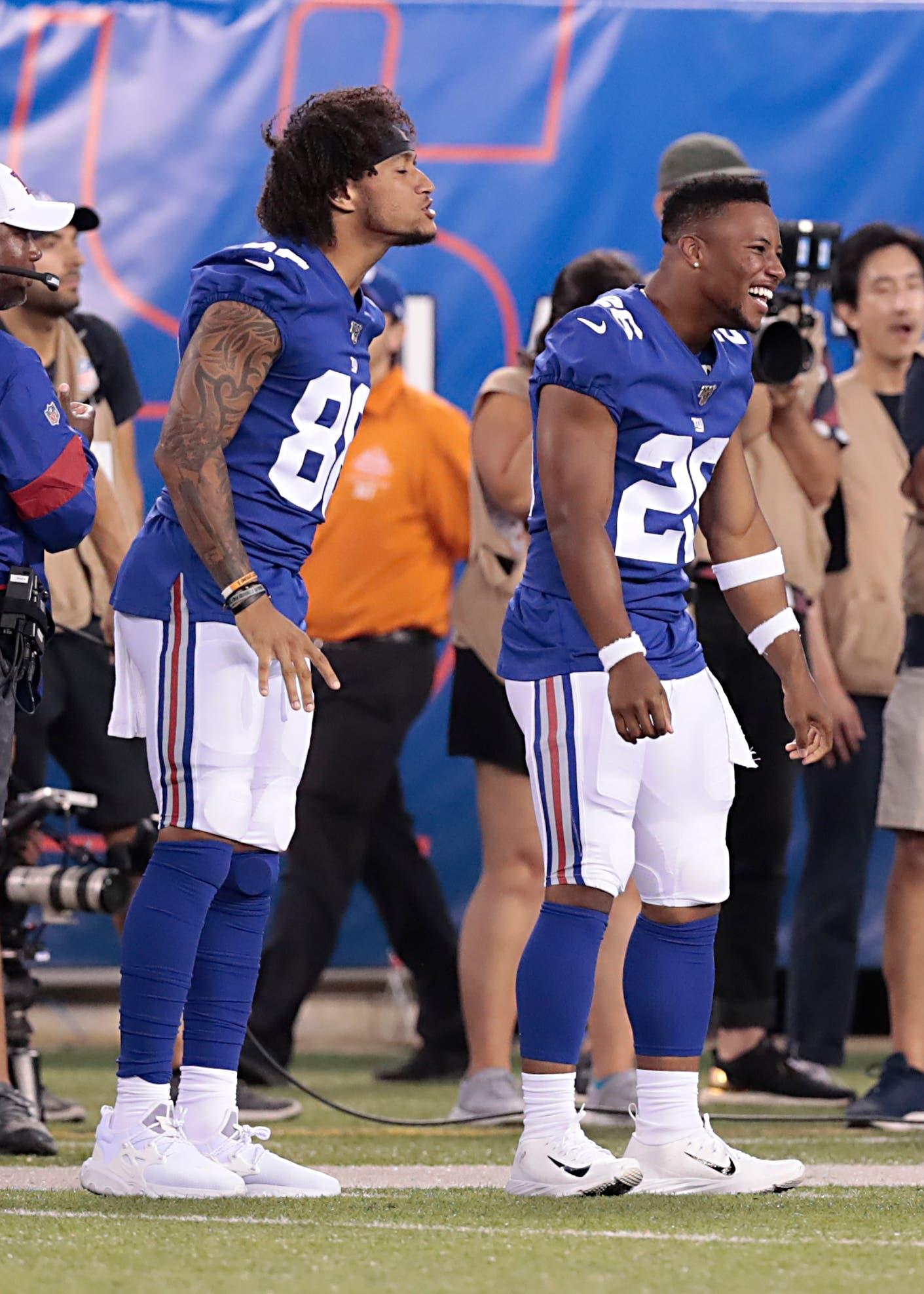 Aug 8, 2019; East Rutherford, NJ, USA; New York Giants running back Saquon Barkley (26) celebrates with tight end Evan Engram (88) after a touchdown reception by wide receiver Bennie Fowler, not pictured, during the first half against the New York Jets at MetLife Stadium. Mandatory Credit: Vincent Carchietta-USA TODAY Sports / Vincent Carchietta