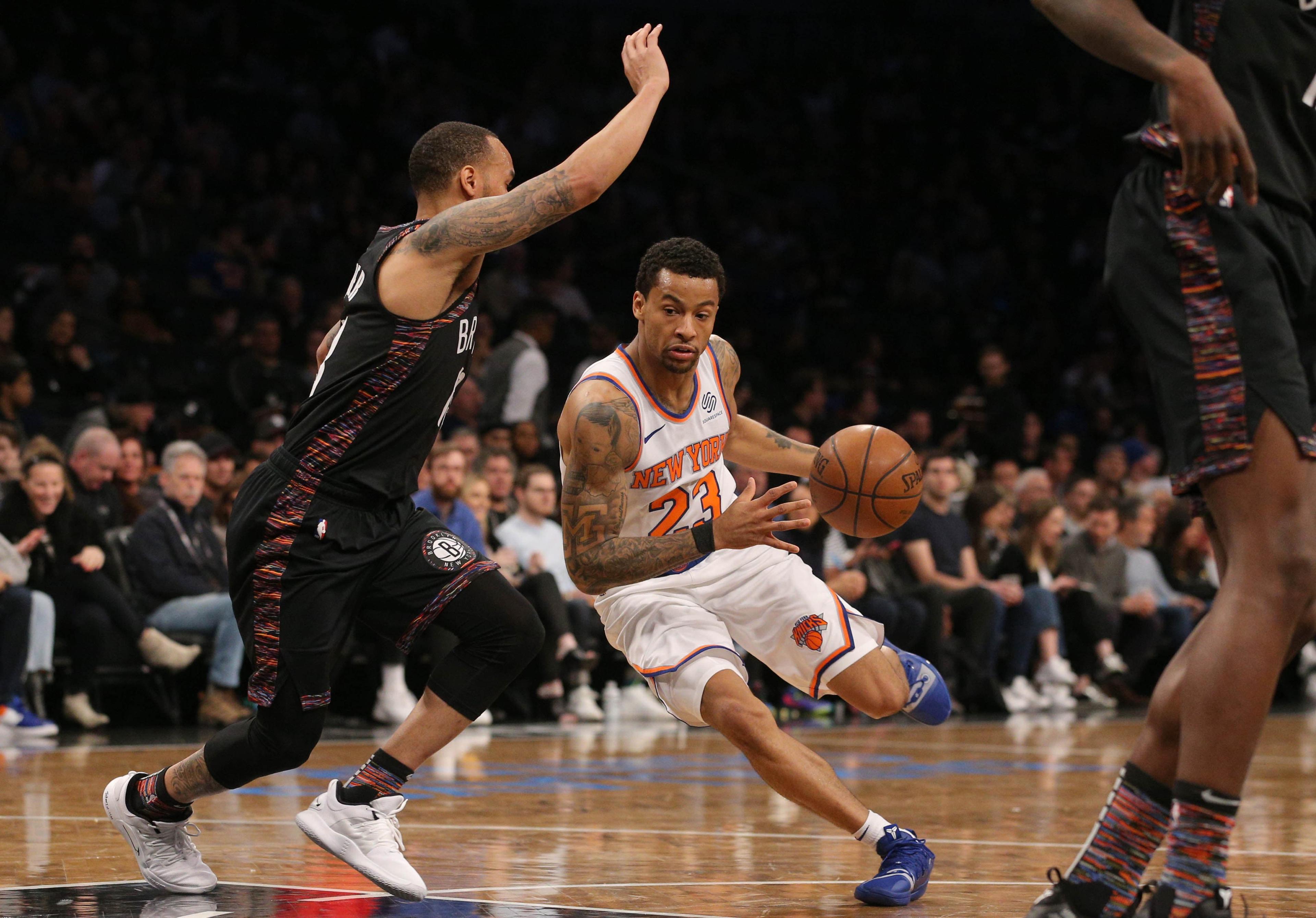 Jan 25, 2019; Brooklyn, NY, USA; New York Knicks guard Trey Burke (23) drives against Brooklyn Nets point guard Shabazz Napier (13) during the second quarter at Barclays Center. Mandatory Credit: Brad Penner-USA TODAY Sports / Brad Penner