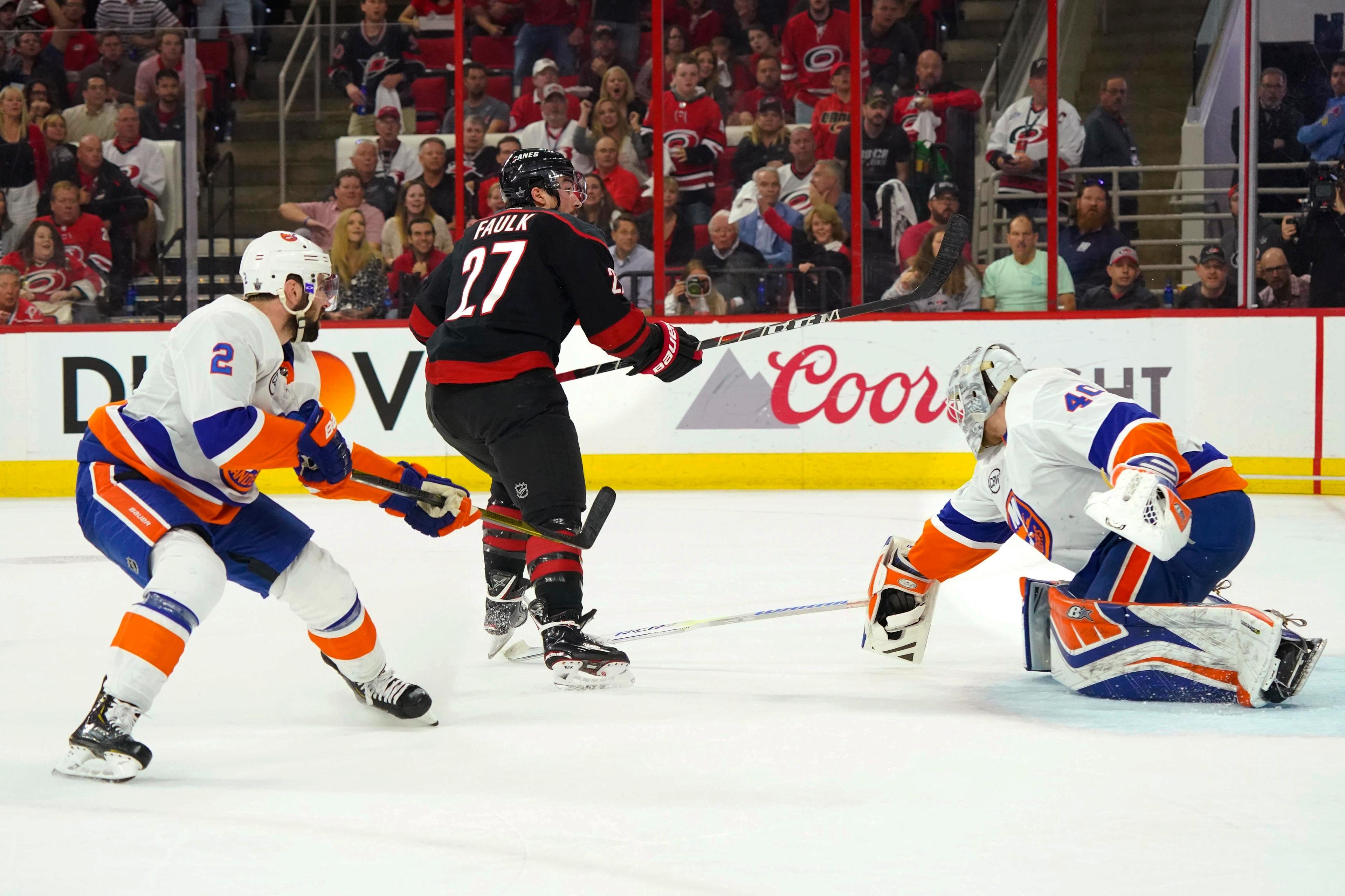 May 1, 2019; Raleigh, NC, USA; Carolina Hurricanes defenseman Justin Faulk (27) scores a goal in the second period against the New York Islanders in game three of the second round of the 2019 Stanley Cup Playoffs at PNC Arena. Mandatory Credit: James Guillory-USA TODAY Sports 