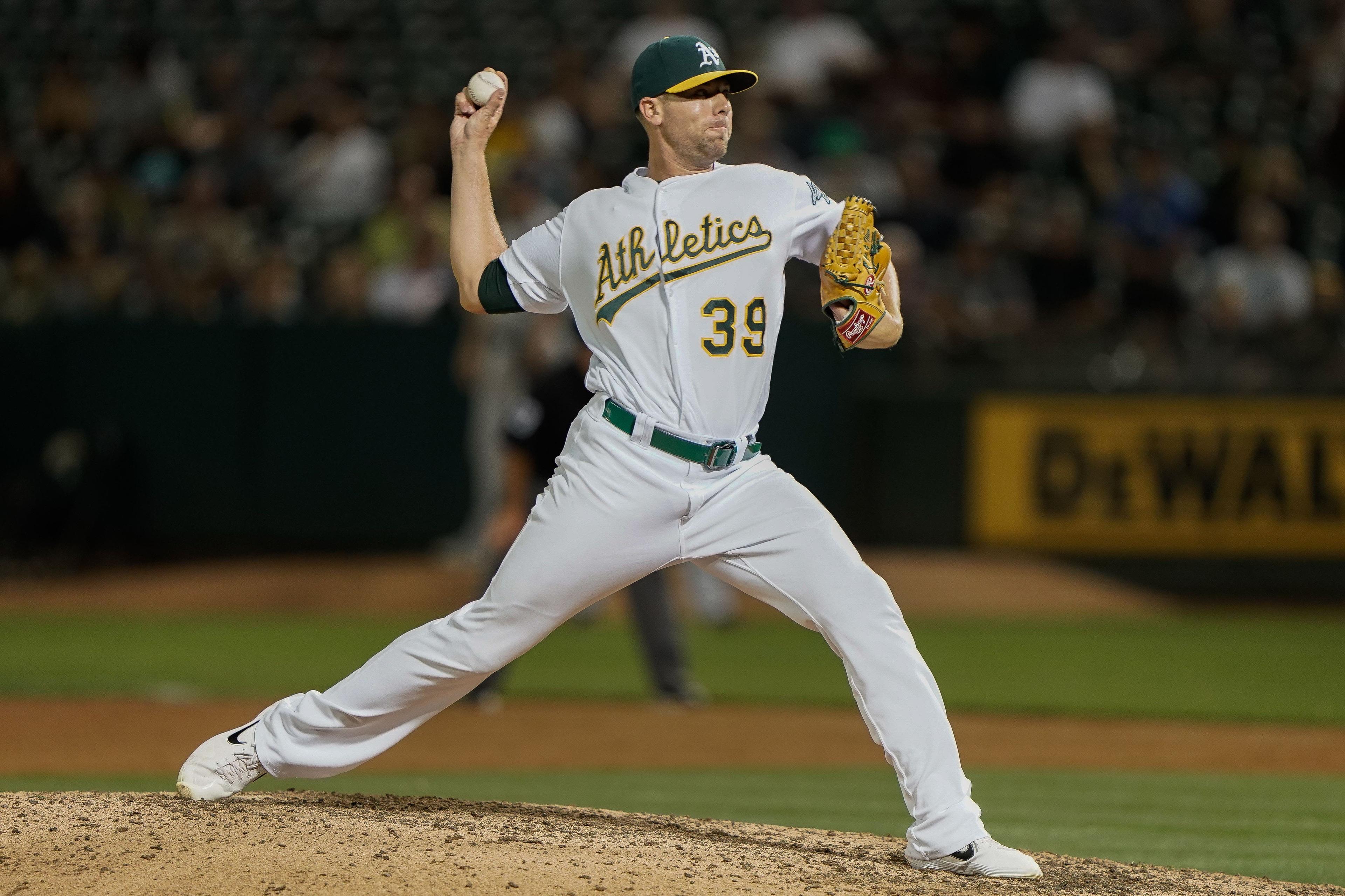 Aug 15, 2019; Oakland, CA, USA; Oakland Athletics relief pitcher Blake Treinen (39) pitches against the Houston Astros during the eighth inning at the Oakland Coliseum. Mandatory Credit: Stan Szeto-USA TODAY Sports / Stan Szeto