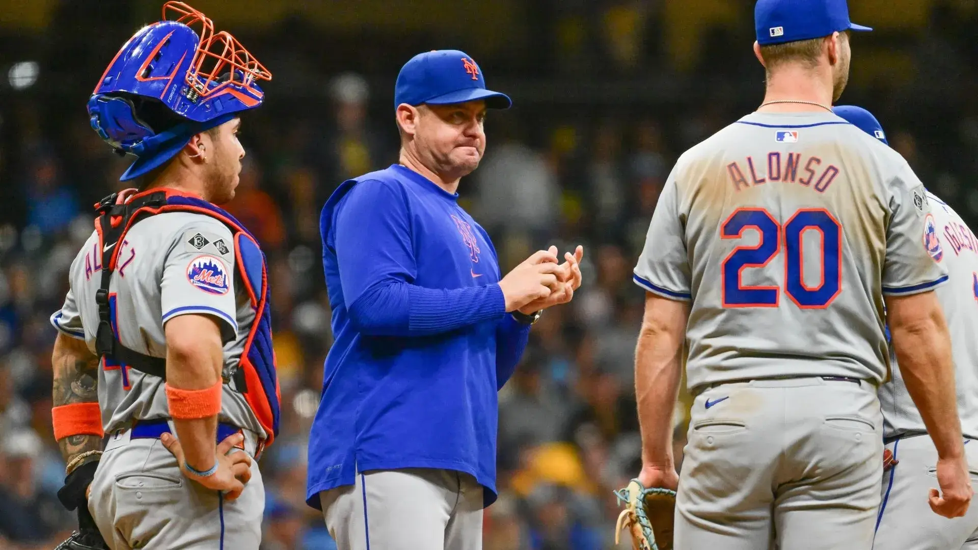 Sep 28, 2024; Milwaukee, Wisconsin, USA; New York Mets manager Carlos Mendoza makes a pitching change in the eighth inning against the Milwaukee Brewers at American Family Field. / Benny Sieu-Imagn Images