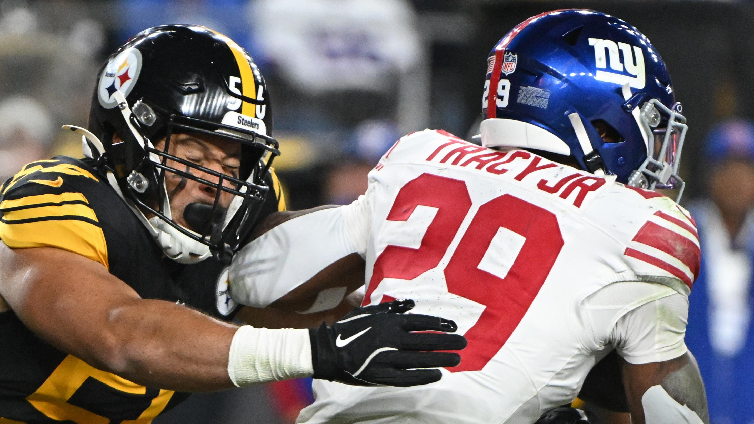 Pittsburgh Steelers linebacker Alex Highsmith (56) tackles New York Giants running back Tyrone Tracy Jr. (29) during the second quarter at Acrisure Stadium