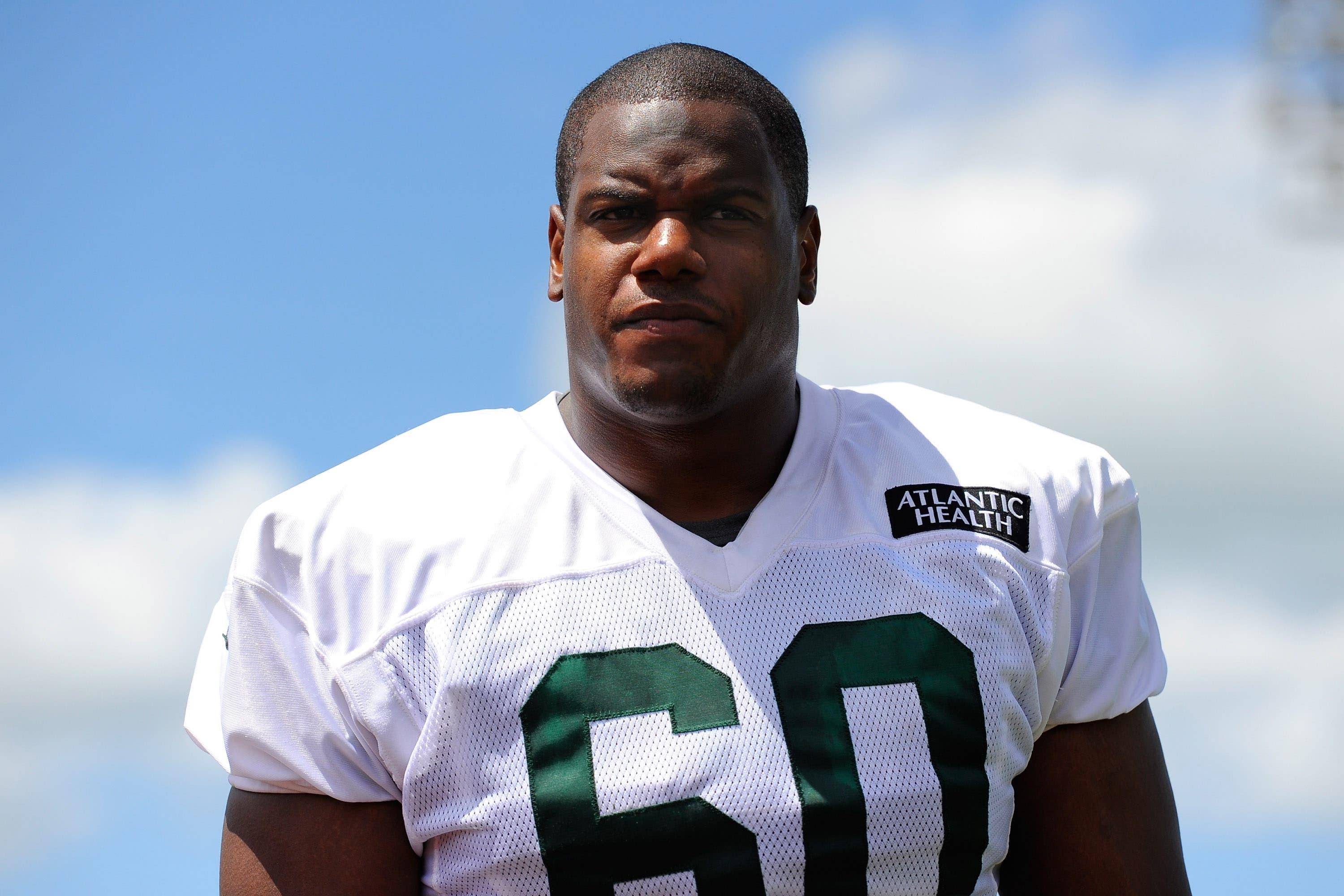 New York Jets offensive tackle D'Brickashaw Ferguson (60) walks off the field following training camp at SUNY Cortland. / Richard Barnes