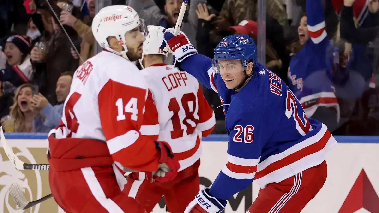 Nov 29, 2023; New York, New York, USA; New York Rangers left wing Jimmy Vesey (26) celebrates his game winning goal in front of Detroit Red Wings center Robby Fabbri (14) and center Andrew Copp (18) during the third period at Madison Square Garden. / Brad Penner-USA TODAY Sports