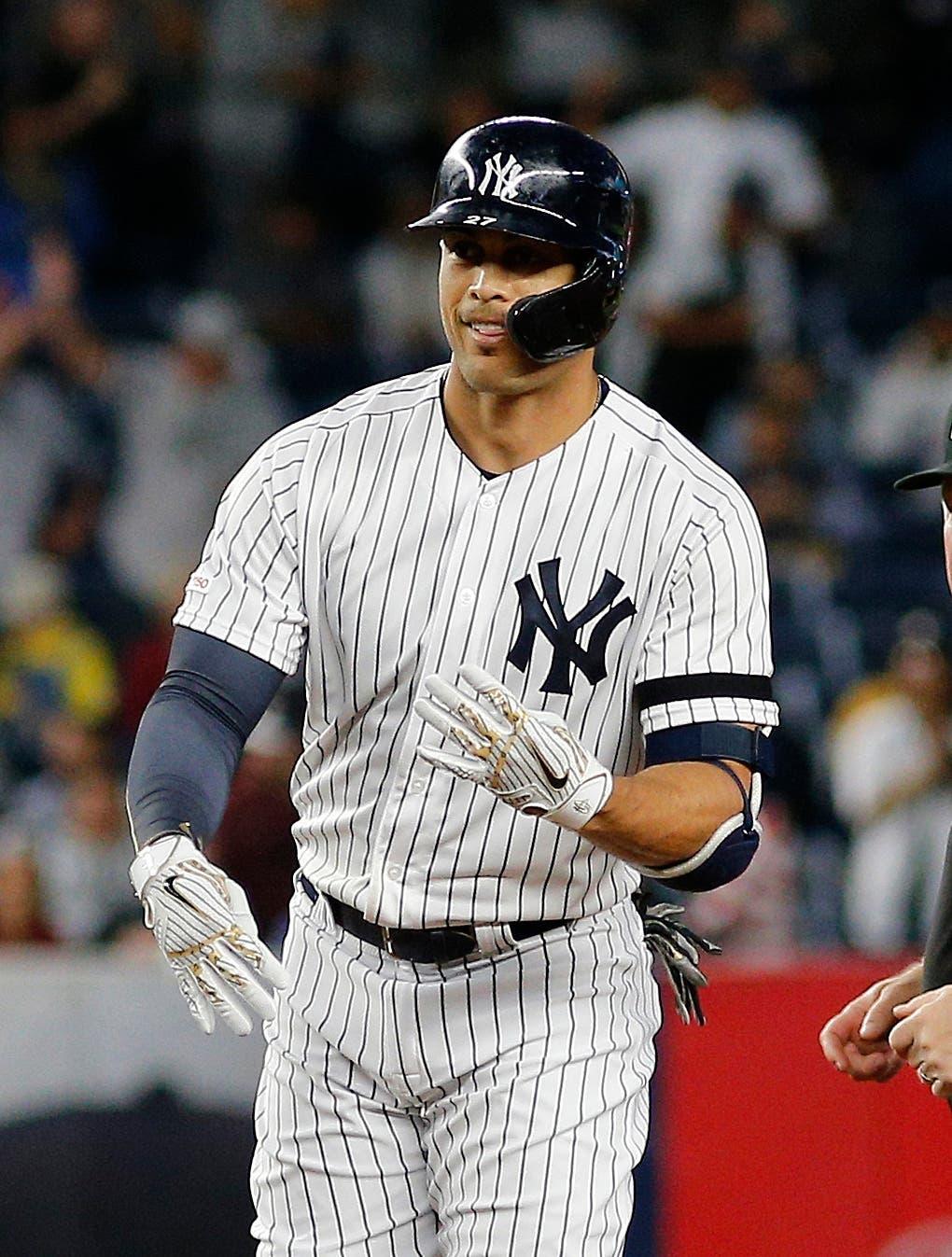 Sep 18, 2019; Bronx, NY, USA; New York Yankees left fielder Giancarlo Stanton (27) reacts after hitting a double against the Los Angeles Angels during the second inning at Yankee Stadium. Mandatory Credit: Andy Marlin-USA TODAY Sports / Andy Marlin