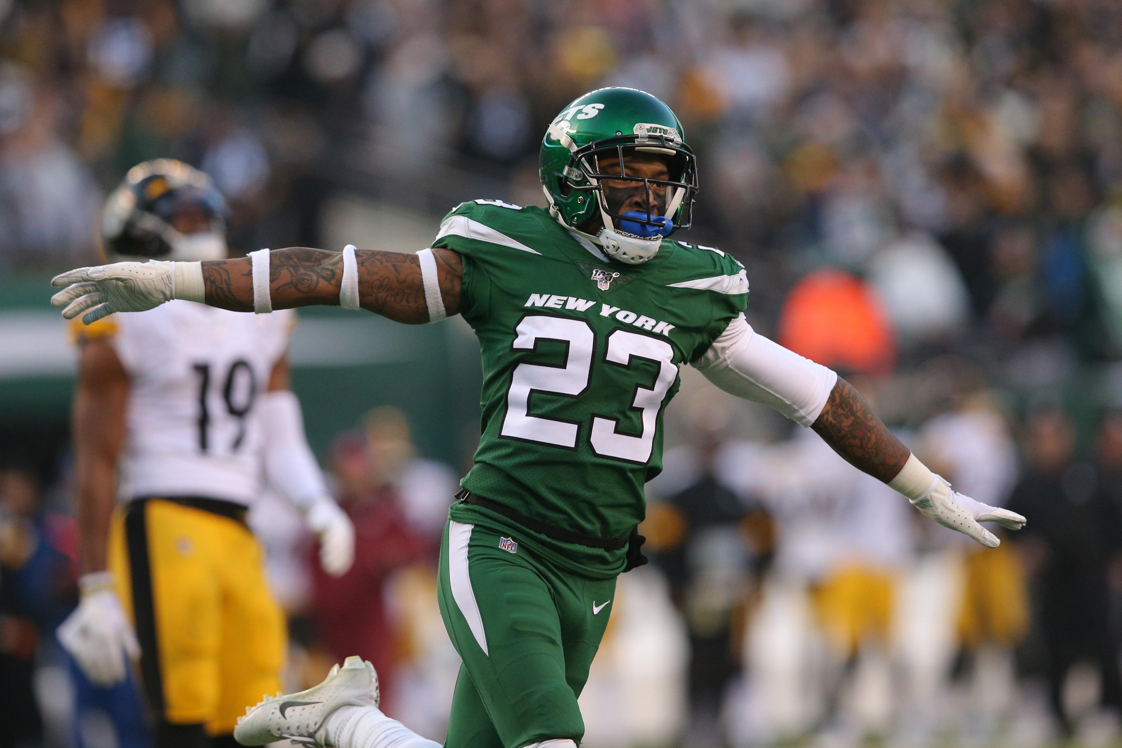 Dec 22, 2019; East Rutherford, New Jersey, USA; New York Jets cornerback Arthur Maulet (23) celebrates in front of Pittsburgh Steelers wide receiver JuJu Smith-Schuster (19) during the fourth quarter at MetLife Stadium. Mandatory Credit: Brad Penner-USA TODAY Sports