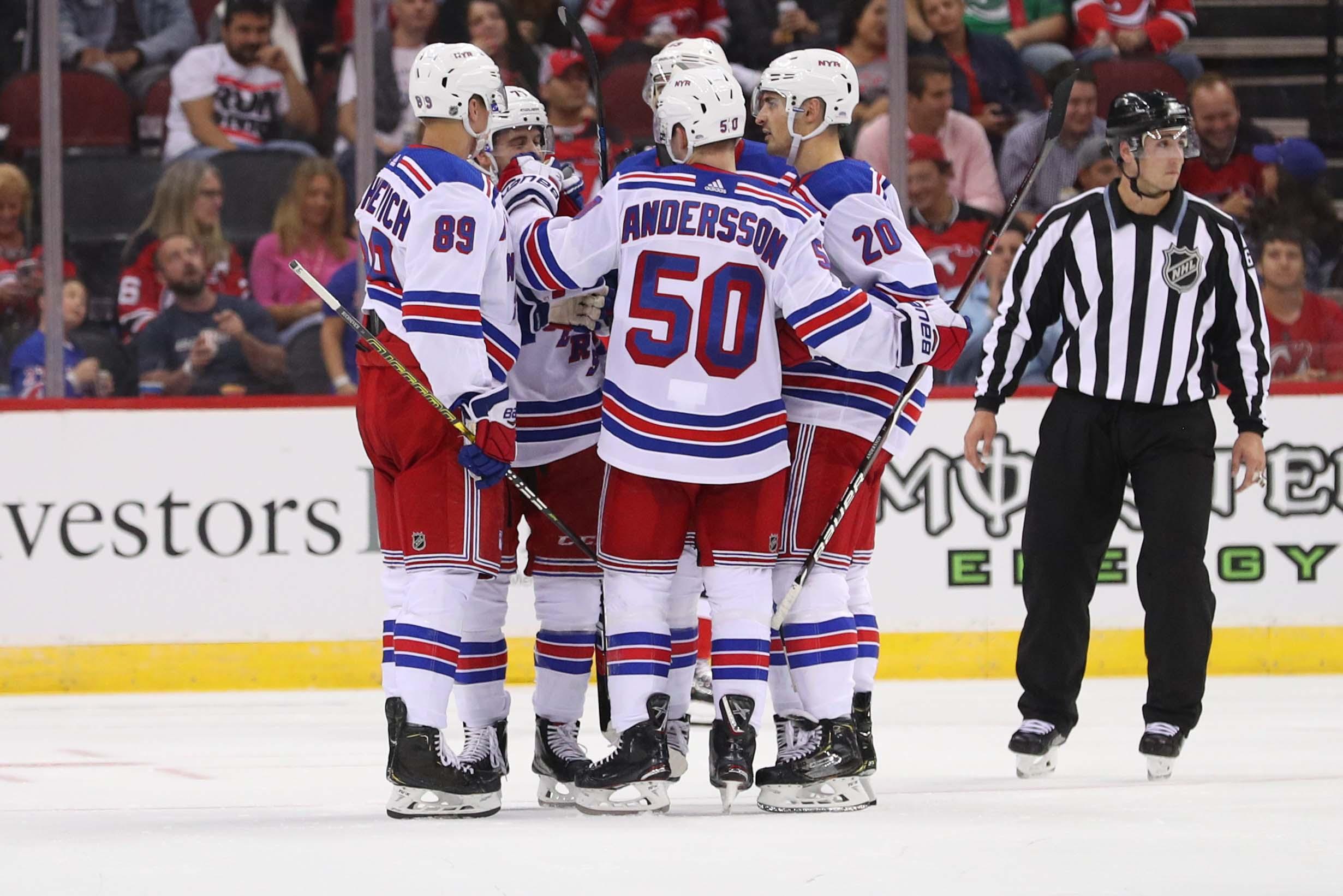 Sep 17, 2018; Newark, NJ, USA; The New York Rangers celebrate a goal by New York Rangers right wing Pavel Buchnevich (89) during the second period of their game against the New Jersey Devils at Prudential Center. Mandatory Credit: Ed Mulholland-USA TODAY Sports / Ed Mulholland