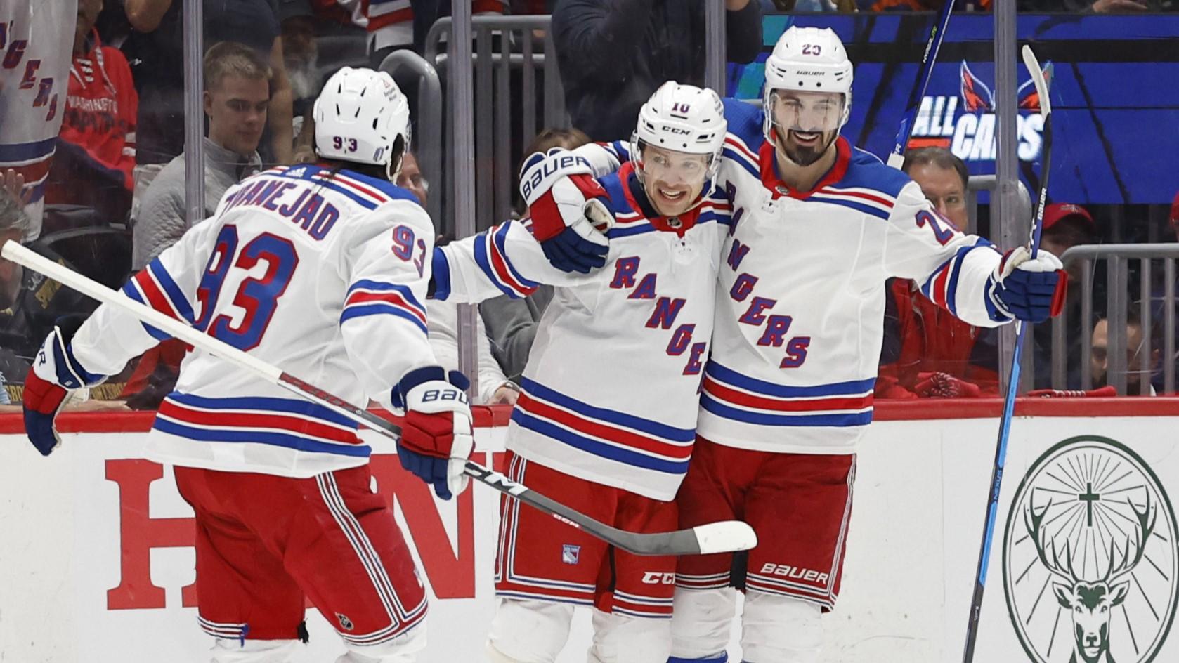 Apr 28, 2024; Washington, District of Columbia, USA; New York Rangers left wing Artemi Panarin (10) celebrates with teammates after scoring a goal against the Washington Capitals in the third period in game four of the first round of the 2024 Stanley Cup Playoffs at Capital One Arena. Mandatory Credit: Geoff Burke-USA TODAY Sports / © Geoff Burke-USA TODAY Sports