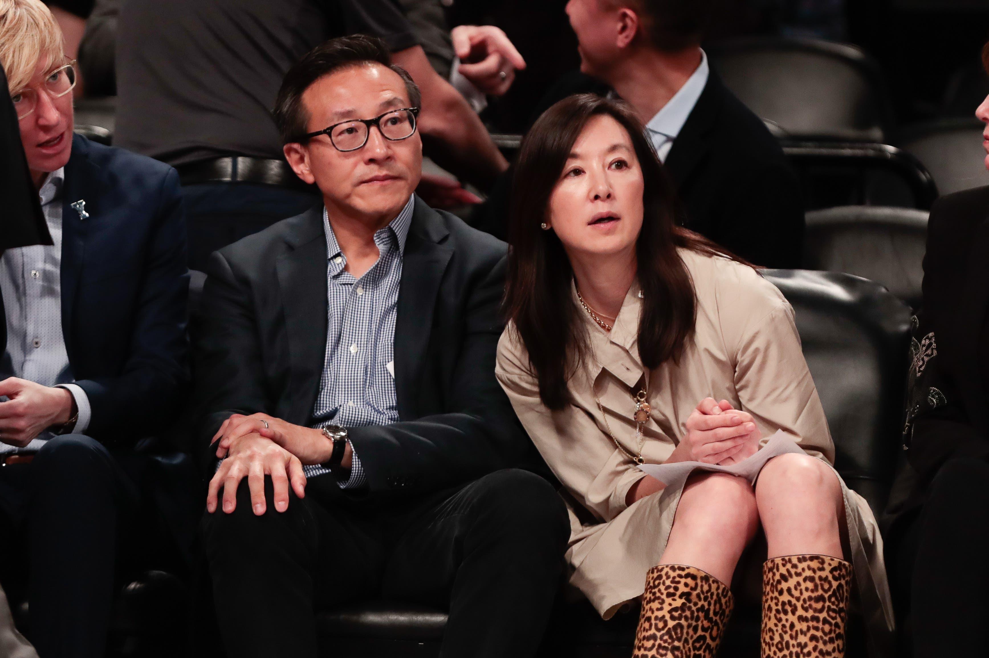 May 9, 2019; New York City, NY, USA; Taiwanese businessman Joe Tsai (left) looks on during the second half of the preseason WNBA game between the New York Liberty and the China National Team at Barclays Center. Mandatory Credit: Vincent Carchietta-USA TODAY Sports / Vincent Carchietta