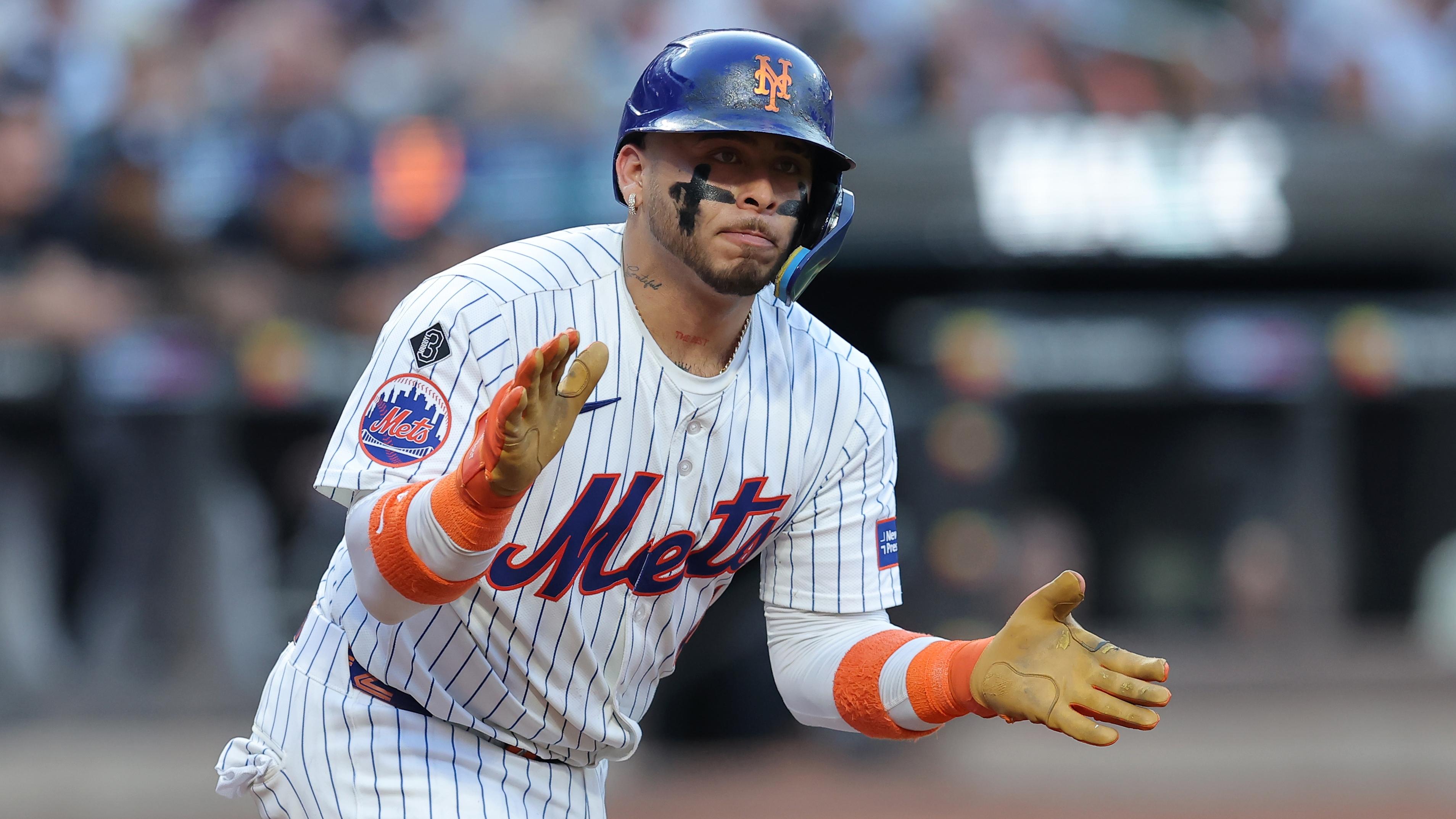 Jun 25, 2024; New York City, New York, USA; New York Mets catcher Francisco Alvarez (4) reacts after drawing a walk during the first inning against the New York Yankees at Citi Field. / Brad Penner - USA TODAY Sports