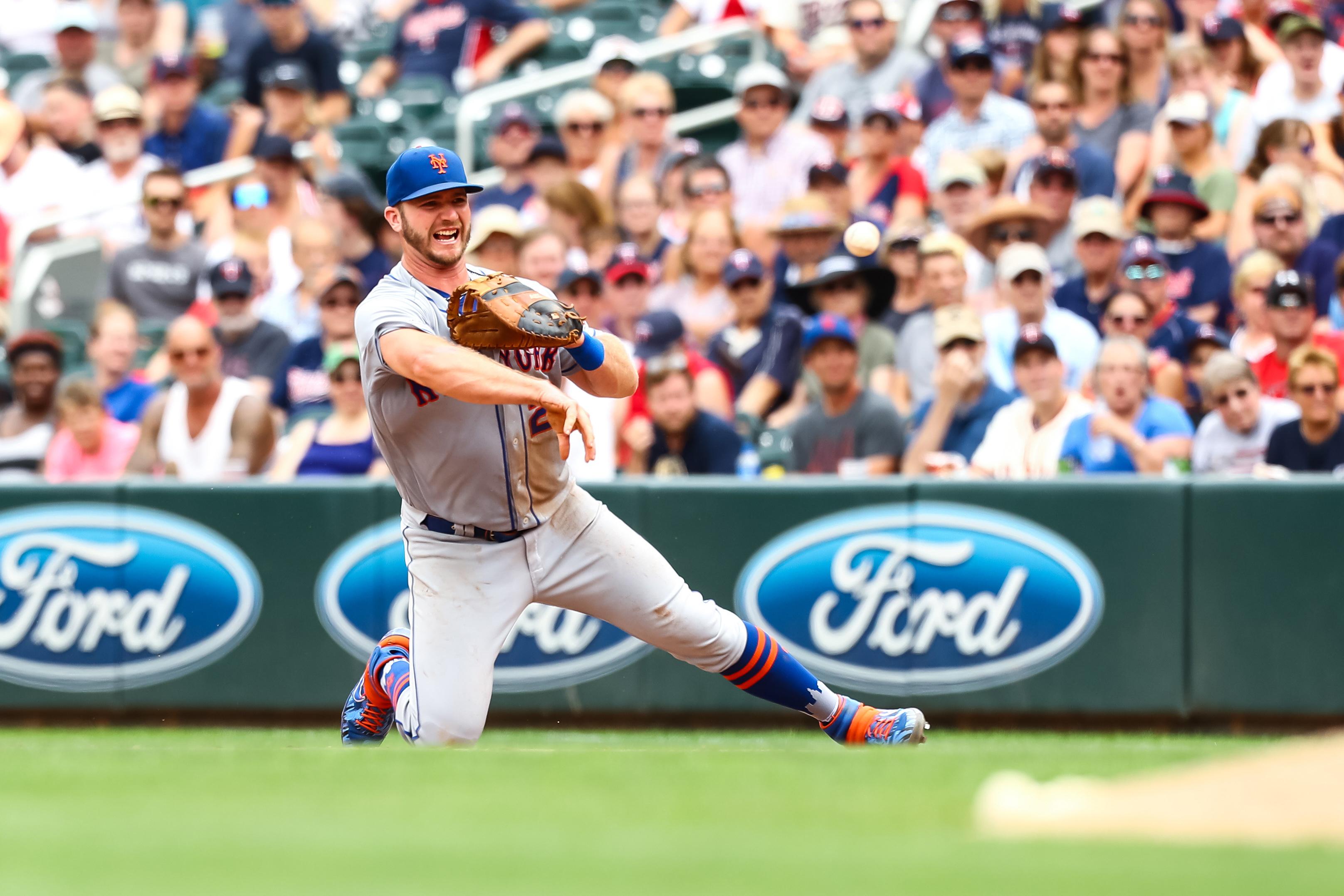 Jul 17, 2019; Minneapolis, MN, USA; New York Mets first baseman Pete Alonso (20) throws to first base for an out against the Minnesota Twins in the sixth inning at Target Field. Mandatory Credit: David Berding-USA TODAY Sports