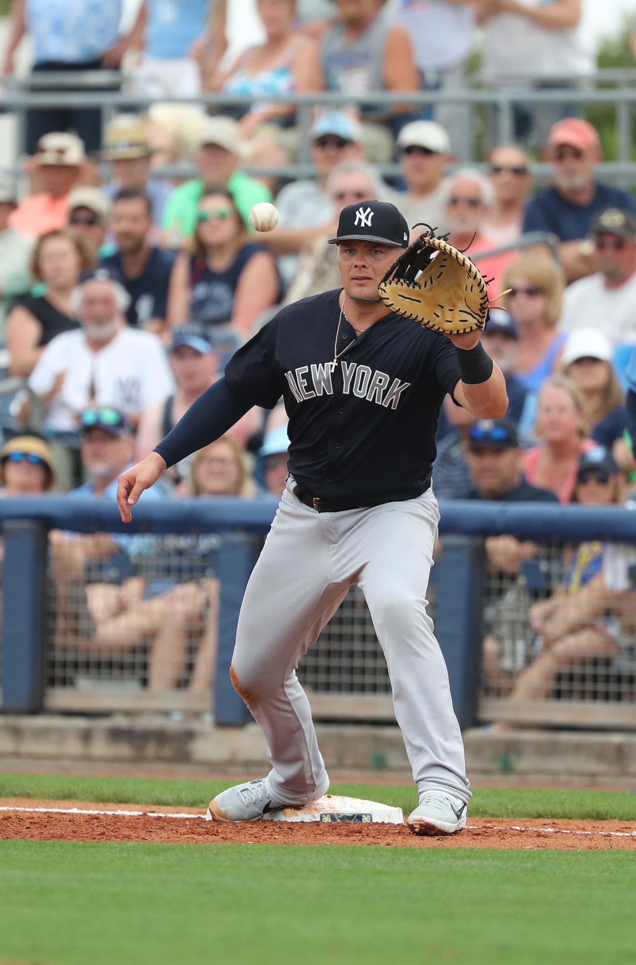 New York Yankees first baseman Luke Voit catches the ball for an out during the second inning against the Tampa Bay Rays at Charlotte Sports Park. / Kim Klement/USA TODAY Sports