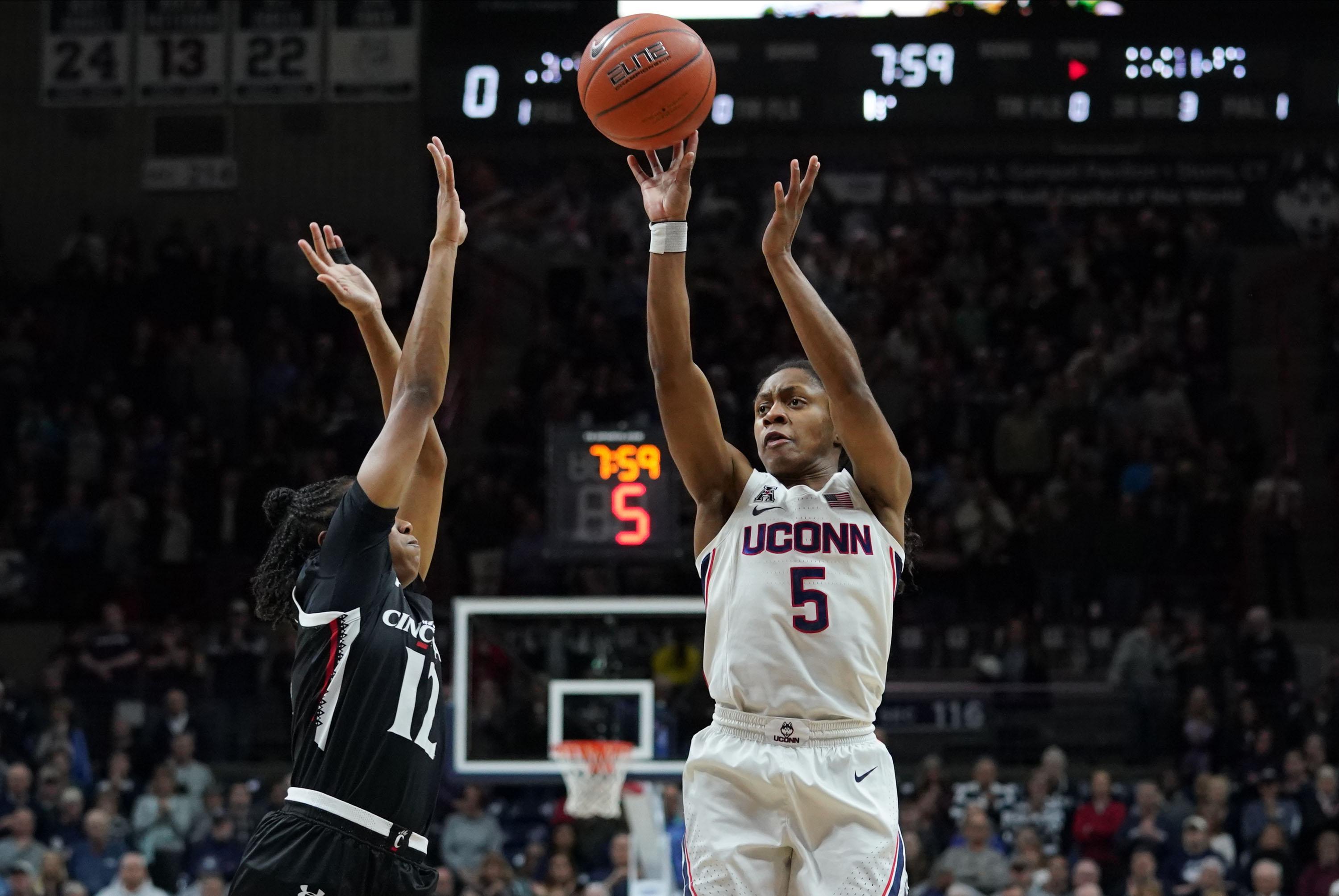 Jan 30, 2020; Storrs, Connecticut, USA; UConn Huskies guard Crystal Dangerfield (5) shoots against Cincinnati Bearcats guard Antoinette Miller (12) in the first half at Harry A. Gampel Pavilion. Mandatory Credit: David Butler II-USA TODAY Sports