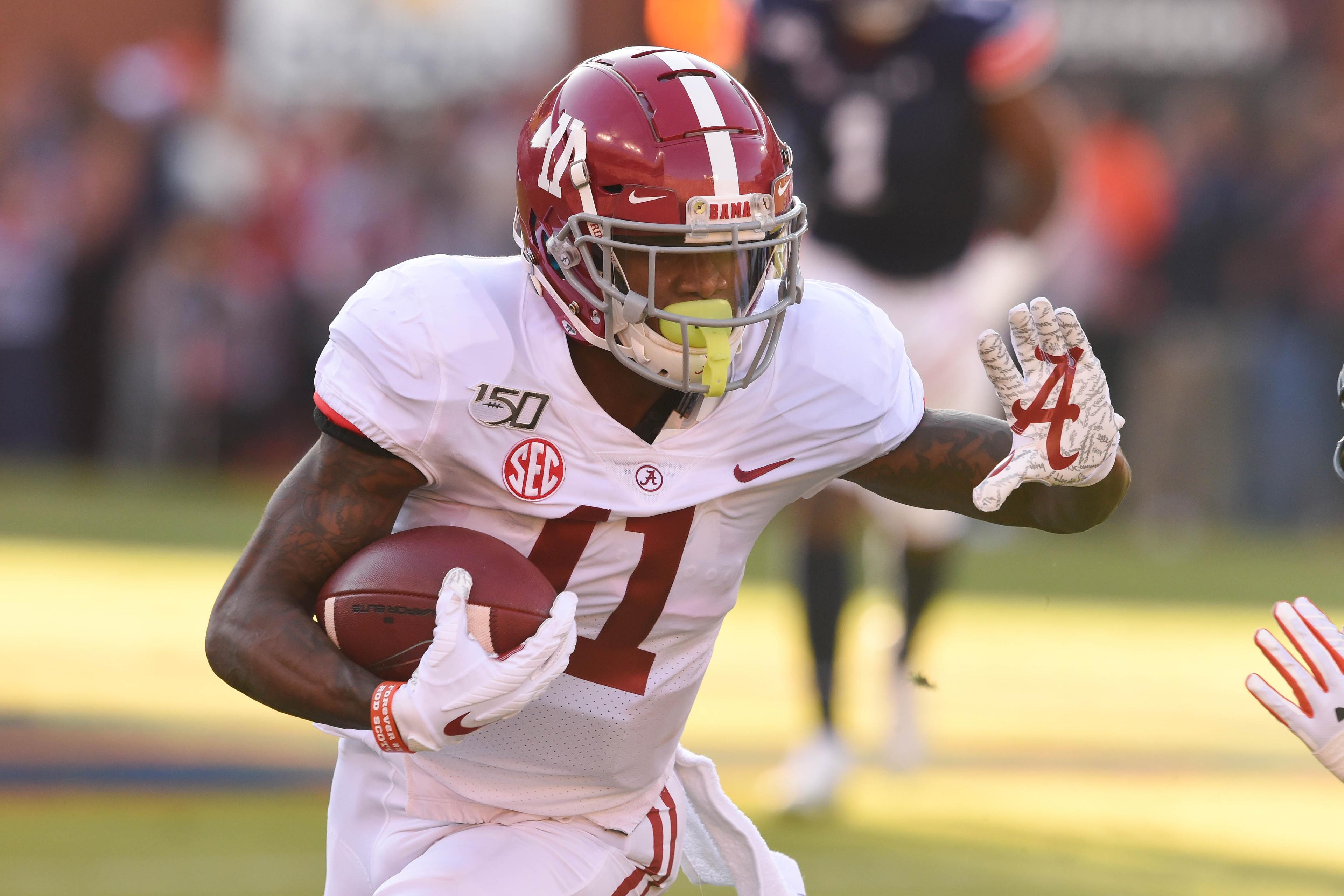 Nov 30, 2019; Auburn, AL, USA; Alabama Crimson Tide wide receiver Henry Ruggs III (11) runs the ball during the first quarter against the Auburn Tigers at Jordan-Hare Stadium. Mandatory Credit: John David Mercer-USA TODAY Sports