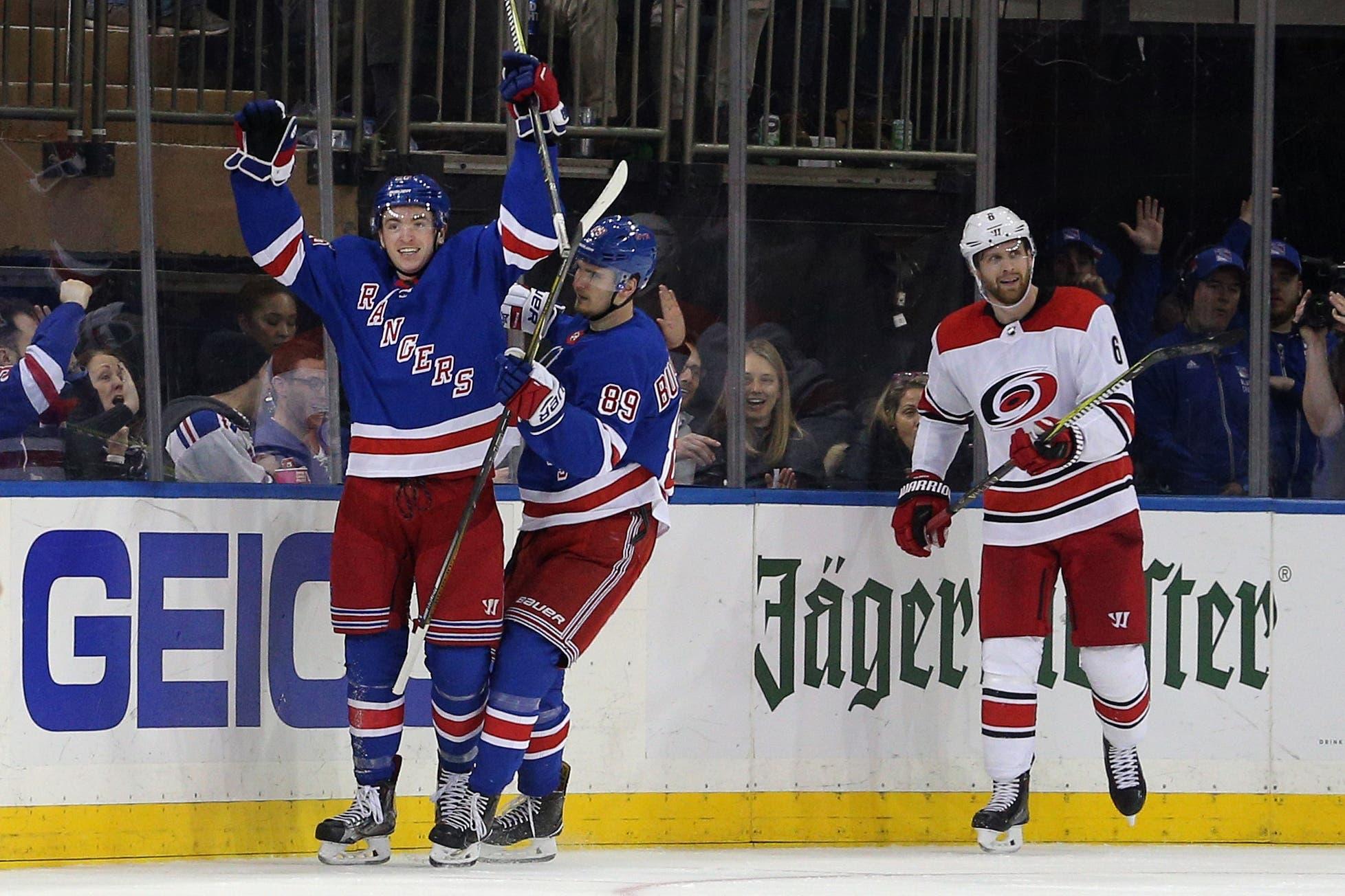 Mar 12, 2018; New York, NY, USA; New York Rangers left wing Jimmy Vesey (26) reacts with left wing Pavel Buchnevich (89) in front of Carolina Hurricanes defenseman Klas Dahlbeck (6) after scoring a goal during the third period at Madison Square Garden. Mandatory Credit: Brad Penner-USA TODAY Sports / Brad Penner