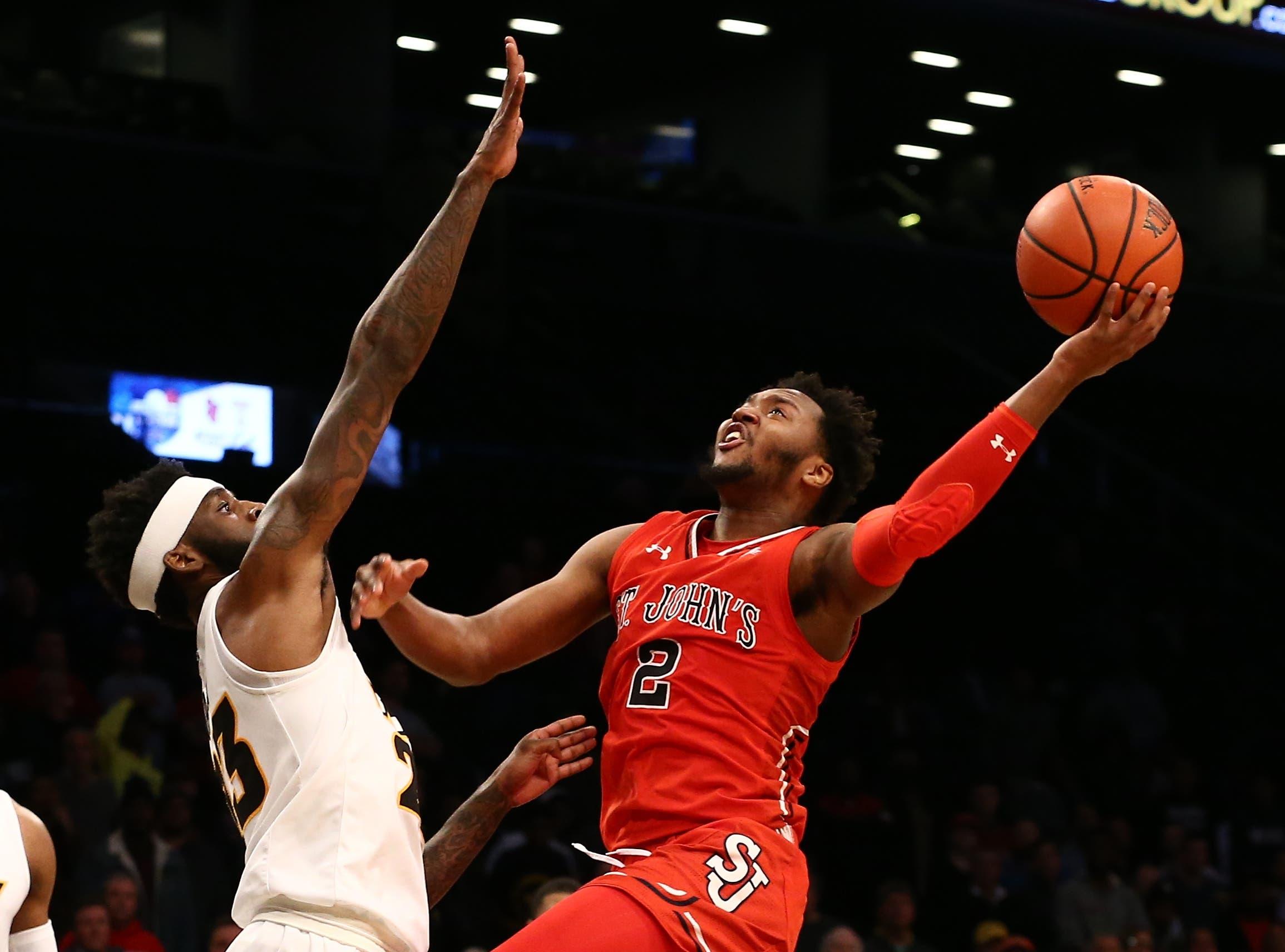 St. John's Red Storm guard Shamorie Ponds puts up a shot against Virginia Commonwealth Rams forward Issac Vann in the second half of the championship game of the Legends Classic at Barclays Center. / Nicole Sweet/USA TODAY Sports