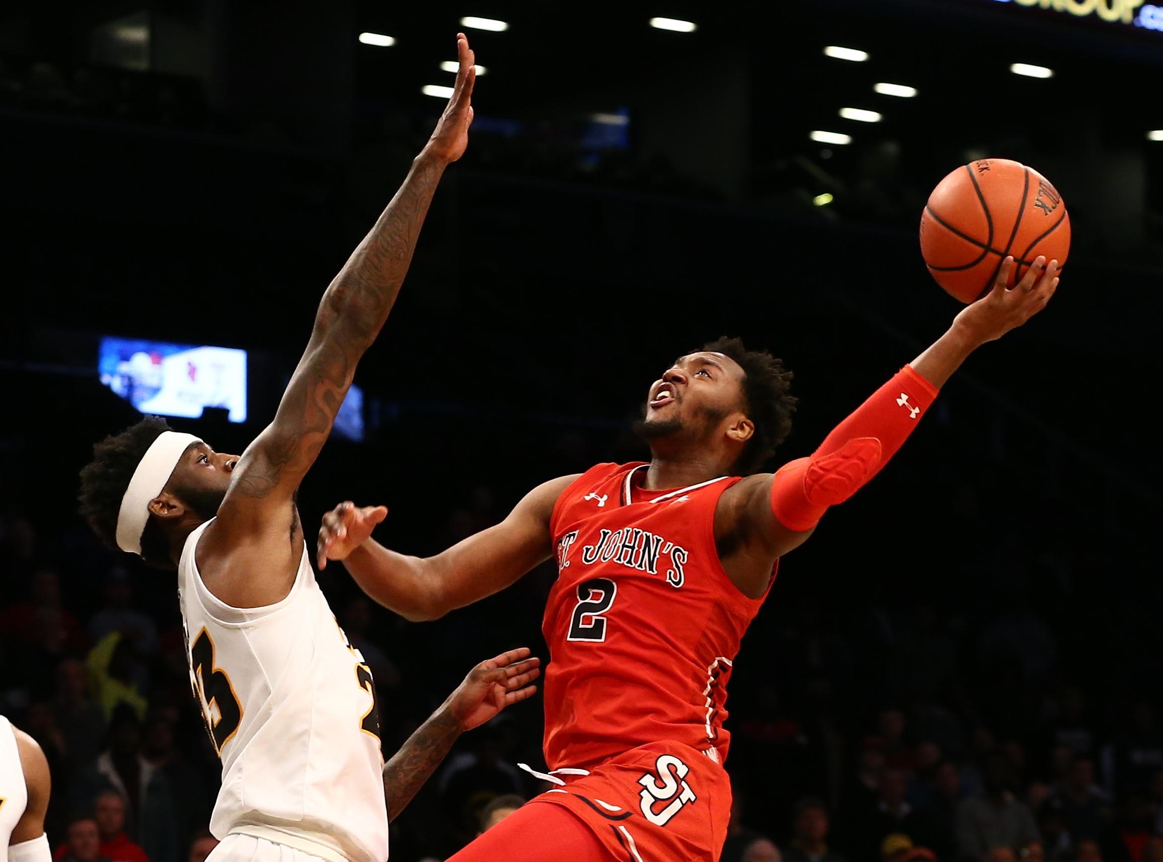 St. John's Red Storm guard Shamorie Ponds puts up a shot against Virginia Commonwealth Rams forward Issac Vann in the second half of the championship game of the Legends Classic at Barclays Center.