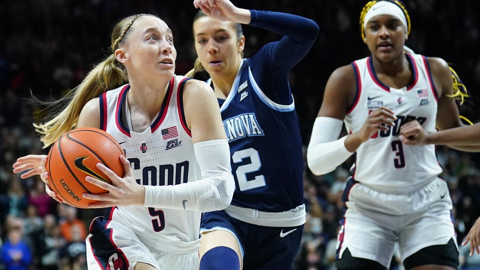 UConn Huskies guard Paige Bueckers (5) drives the ball against Villanova Wildcats guard Bella Runyan (32) in the first half at Harry A. Gampel Pavilion. / David Butler II-USA TODAY Sports
