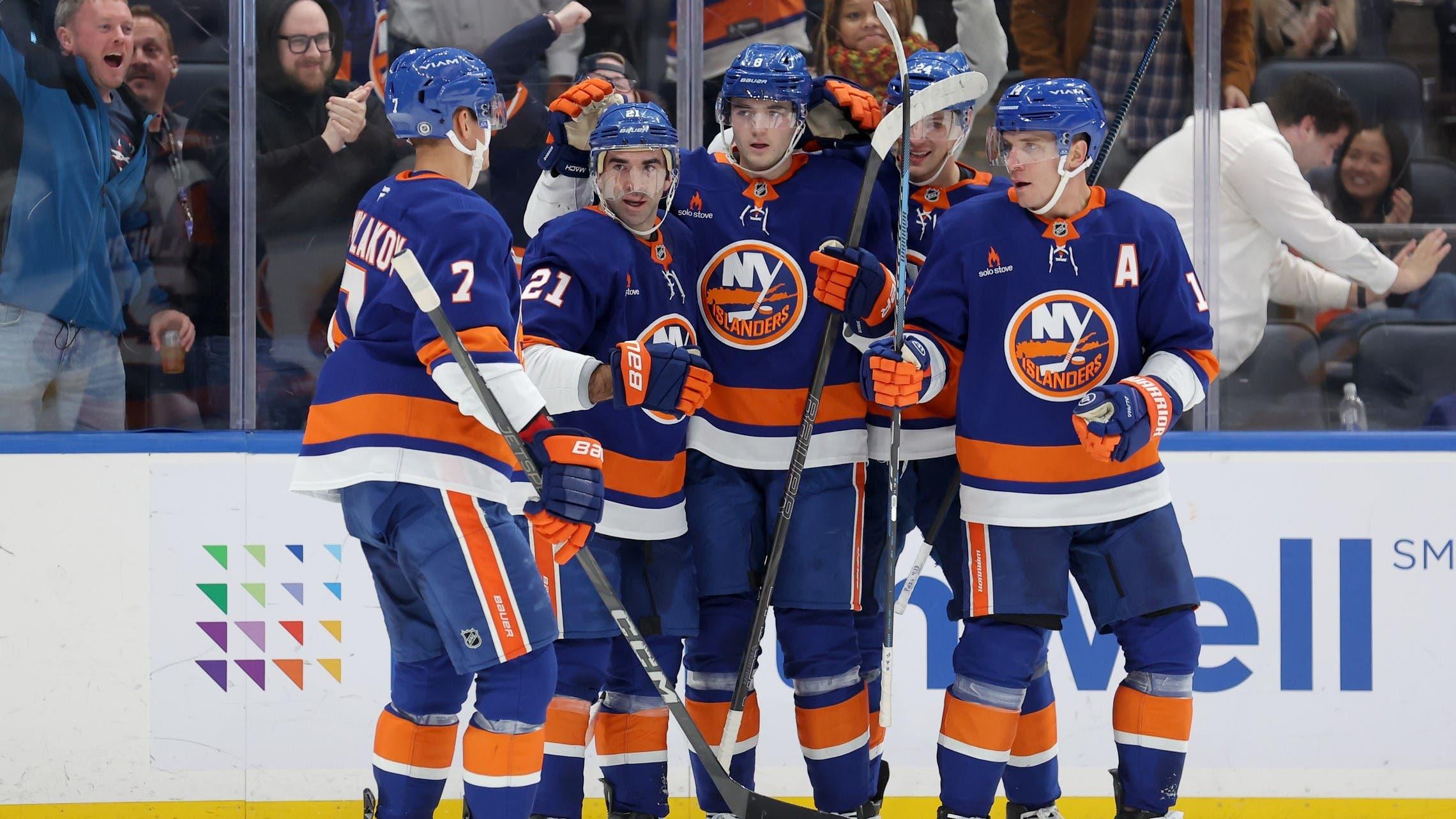 Nov 5, 2024; Elmont, New York, USA; New York Islanders center Kyle Palmieri (21) celebrates his goal against the Pittsburgh Penguins with teammates during the second period at UBS Arena. / Brad Penner-Imagn Images