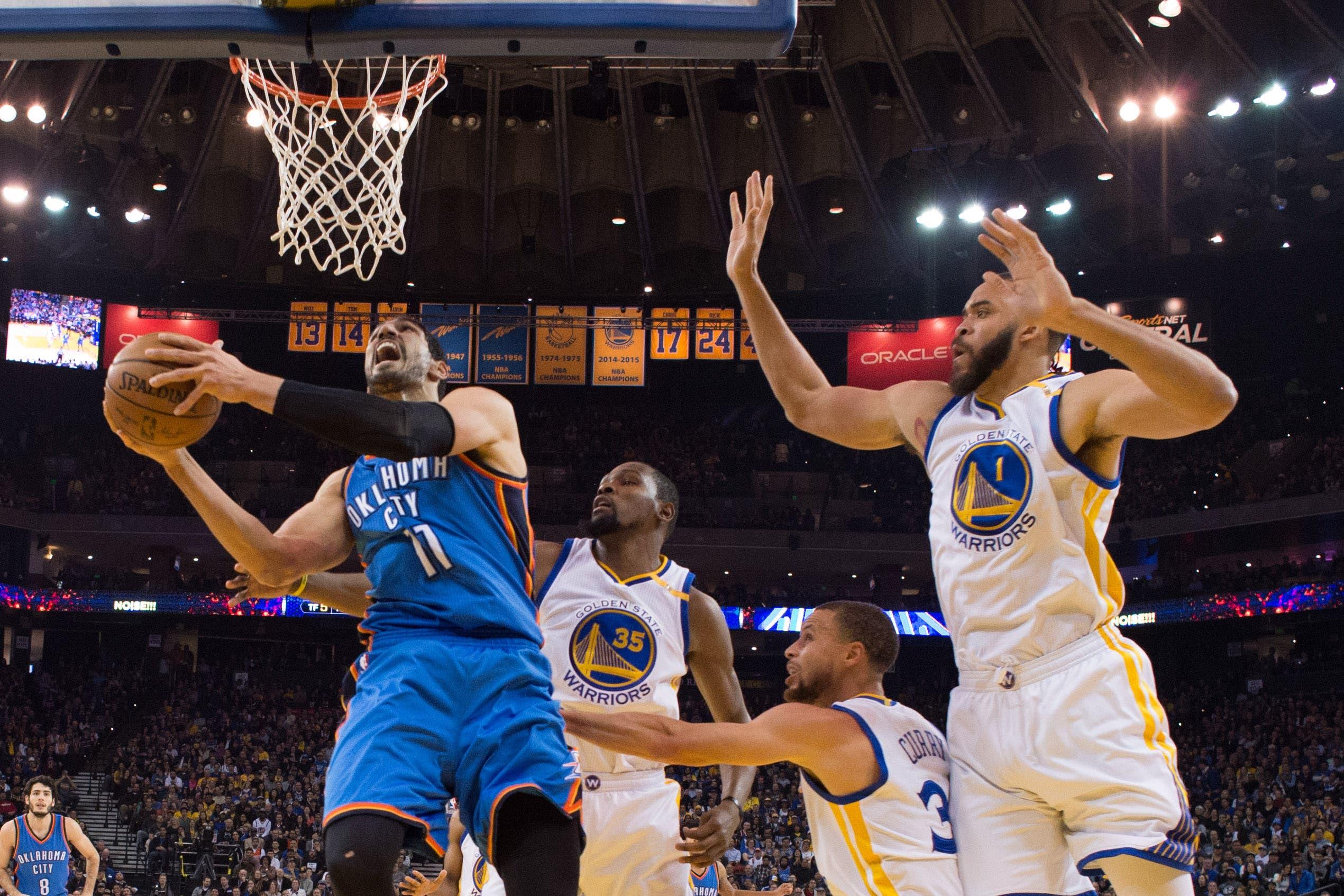 January 18, 2017; Oakland, CA, USA; Oklahoma City Thunder center Enes Kanter (11) shoots the basketball against Golden State Warriors forward Kevin Durant (35), guard Stephen Curry (30), and center JaVale McGee (1) during the first quarter at Oracle Arena. The Warriors defeated the Thunder 121-100. Mandatory Credit: Kyle Terada-USA TODAY Sports / Kyle Terada