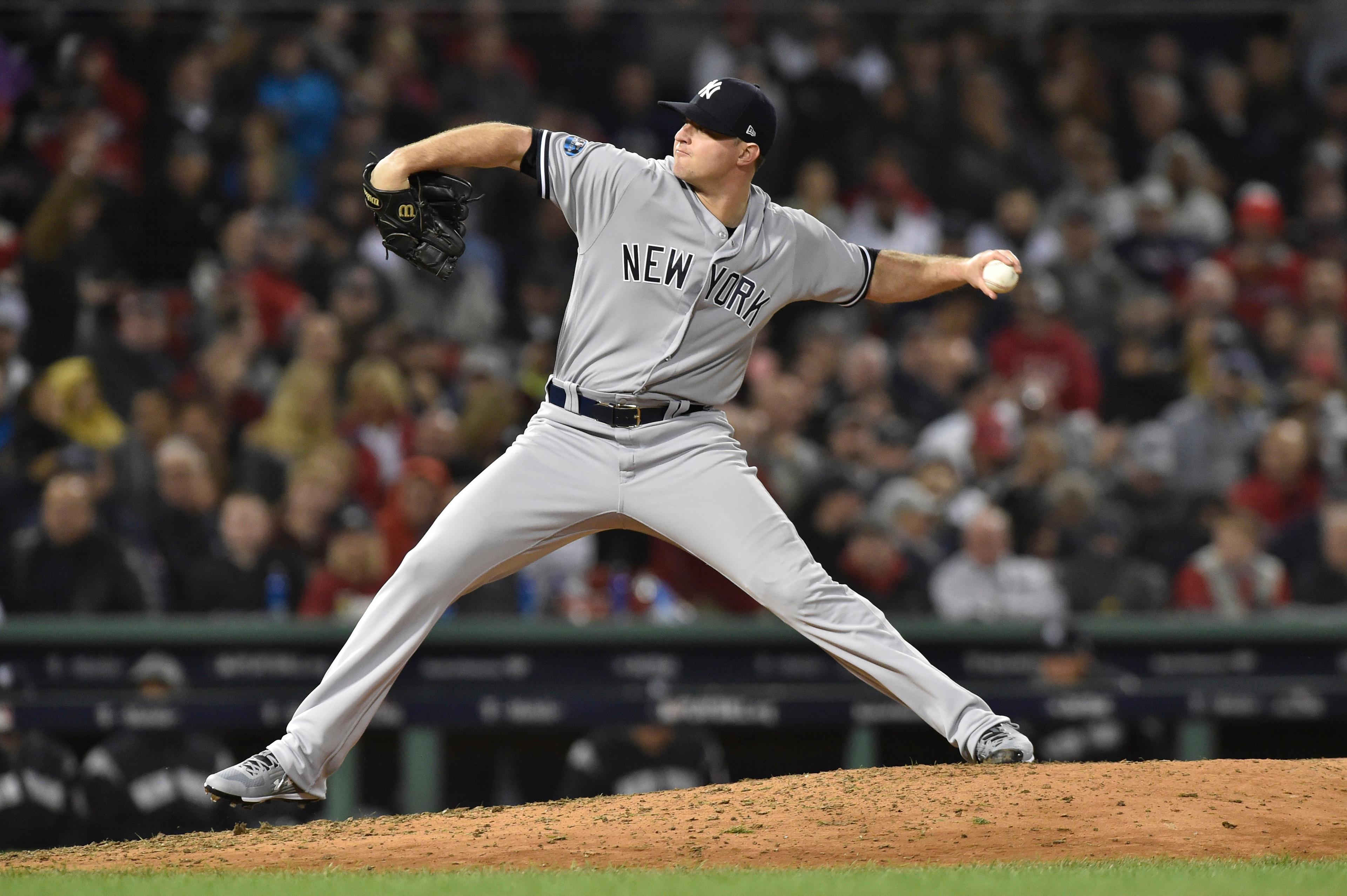 New York Yankees relief pitcher Zach Britton throws the ball during the seventh inning against the Boston Red Sox in Game 1 of the 2018 ALDS at Fenway Park.