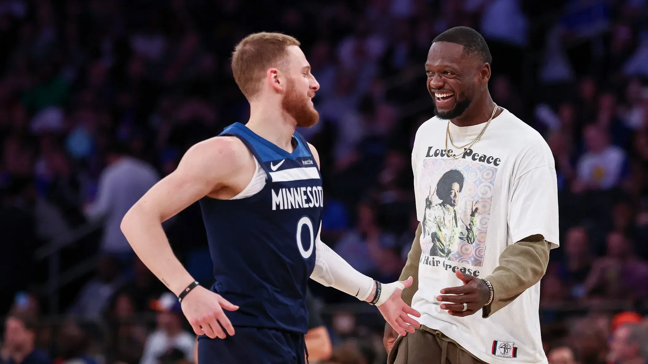 Minnesota Timberwolves guard Donte DiVincenzo (0) celebrates with forward Julius Randle (30) during the first half against the New York Knicks at Madison Square Garden. / Vincent Carchietta-Imagn Images