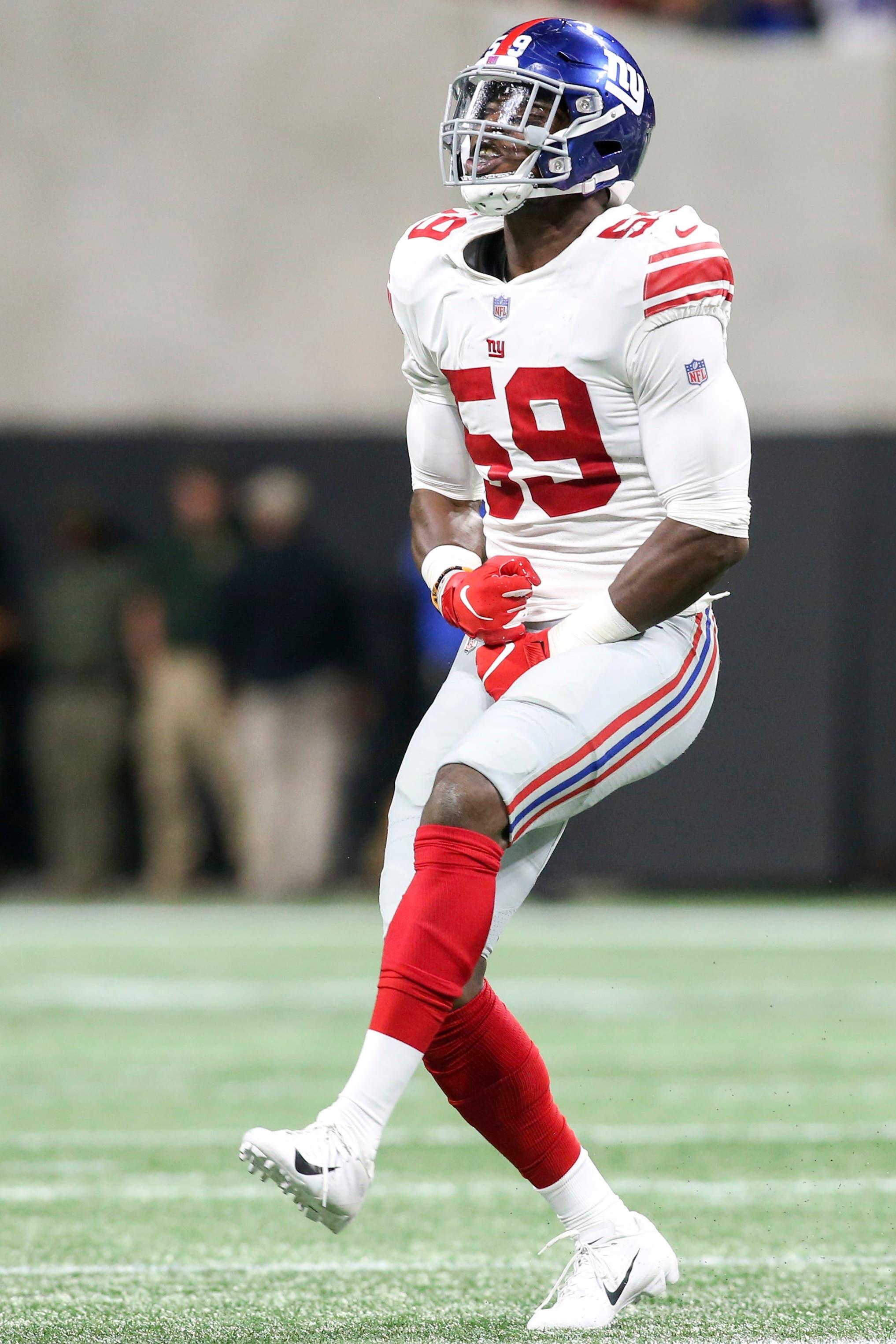 Oct 22, 2018; Atlanta, GA, USA; New York Giants linebacker Lorenzo Carter (59) celebrates after a sack against the Atlanta Falcons in the first quarter at Mercedes-Benz Stadium. Mandatory Credit: Brett Davis-USA TODAY Sports / Brett Davis