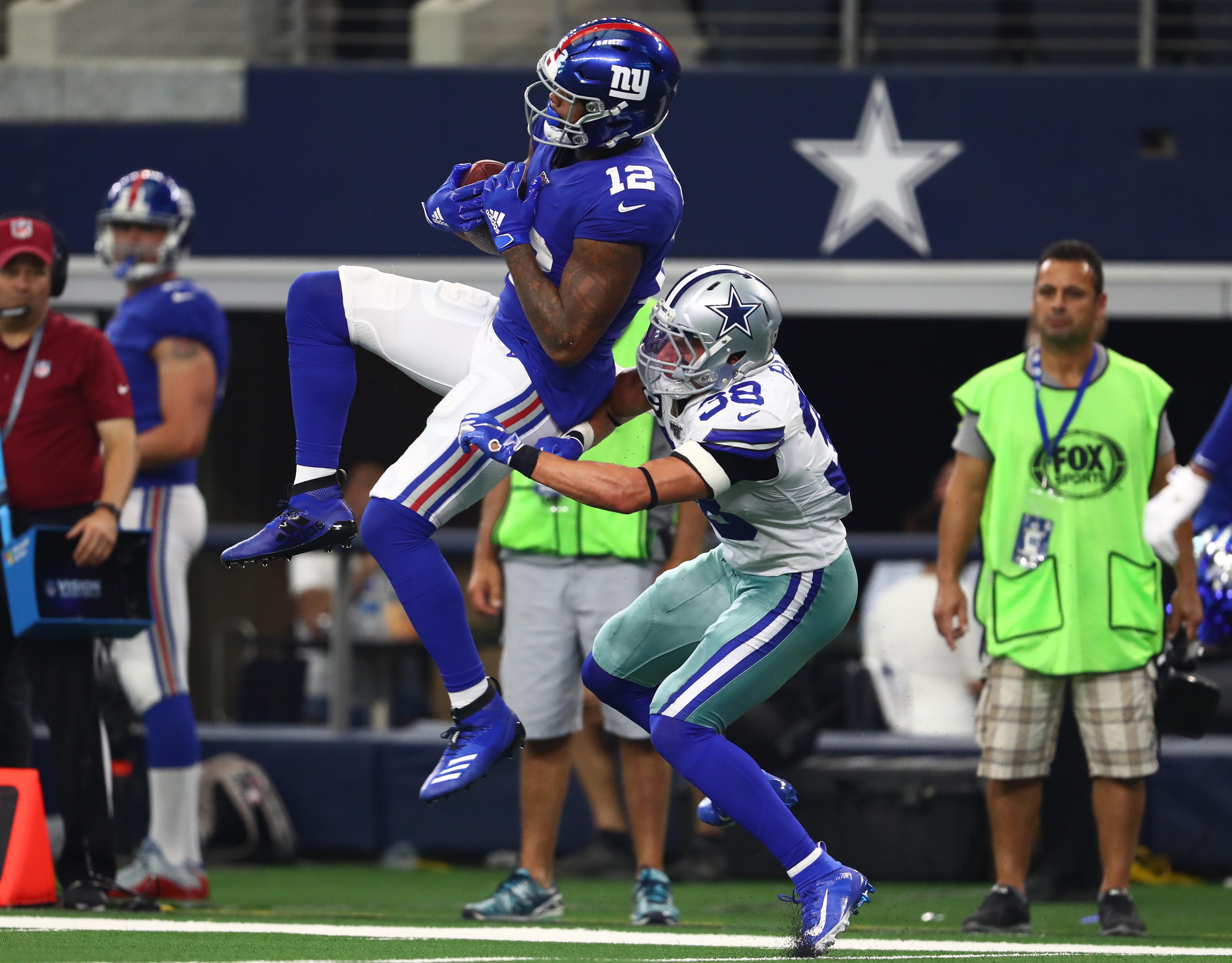 Sep 8, 2019; Arlington, TX, USA; New York Giants receiver Cody Latimer (12) makes a reception against Dallas Cowboys safety Jeff Heath (38) in the third quarter at AT&T Stadium. Mandatory Credit: Matthew Emmons-USA TODAY Sports