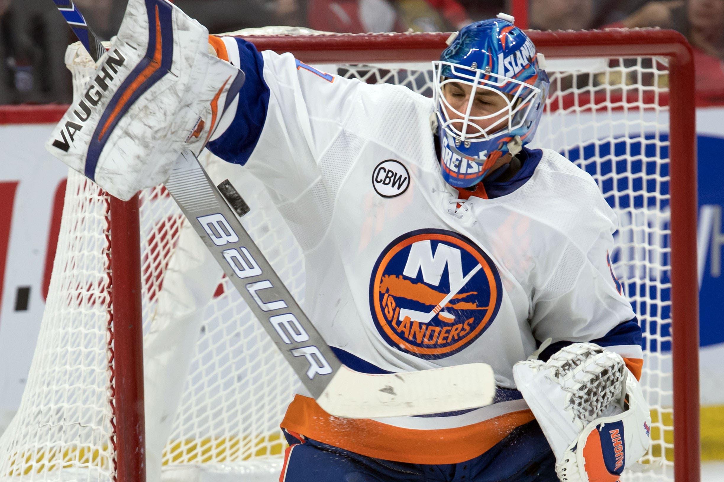 Mar 7, 2019; Ottawa, Ontario, CAN; New York Islanders goalie Thomas Greiss (1) makes a save in the second period against the Ottawa Senators at the Canadian Tire Centre. Mandatory Credit: Marc DesRosiers-USA TODAY Sports / Marc DesRosiers