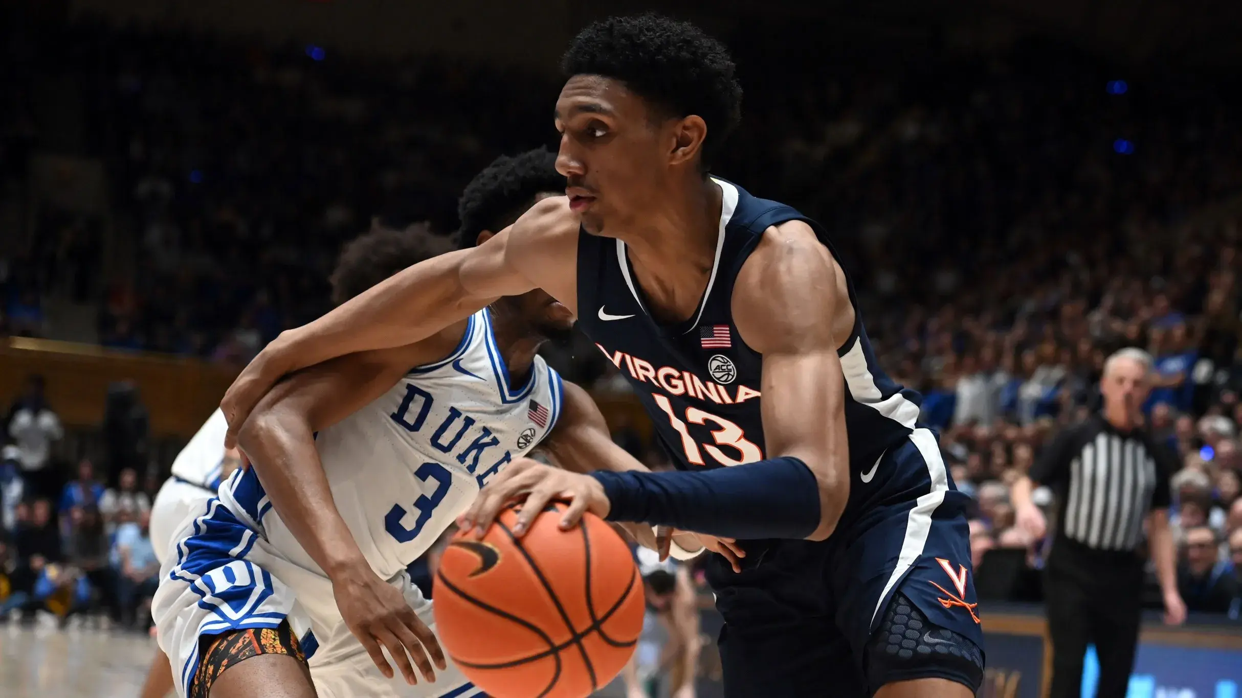Mar 2, 2024; Durham, North Carolina, USA; Virginia Cavaliers guard Ryan Dunn (13) drives to the basket a Duke Blue Devils guard Jeremy Roach (3) defends during the first half at Cameron Indoor Stadium. / Rob Kinnan-USA TODAY Sports