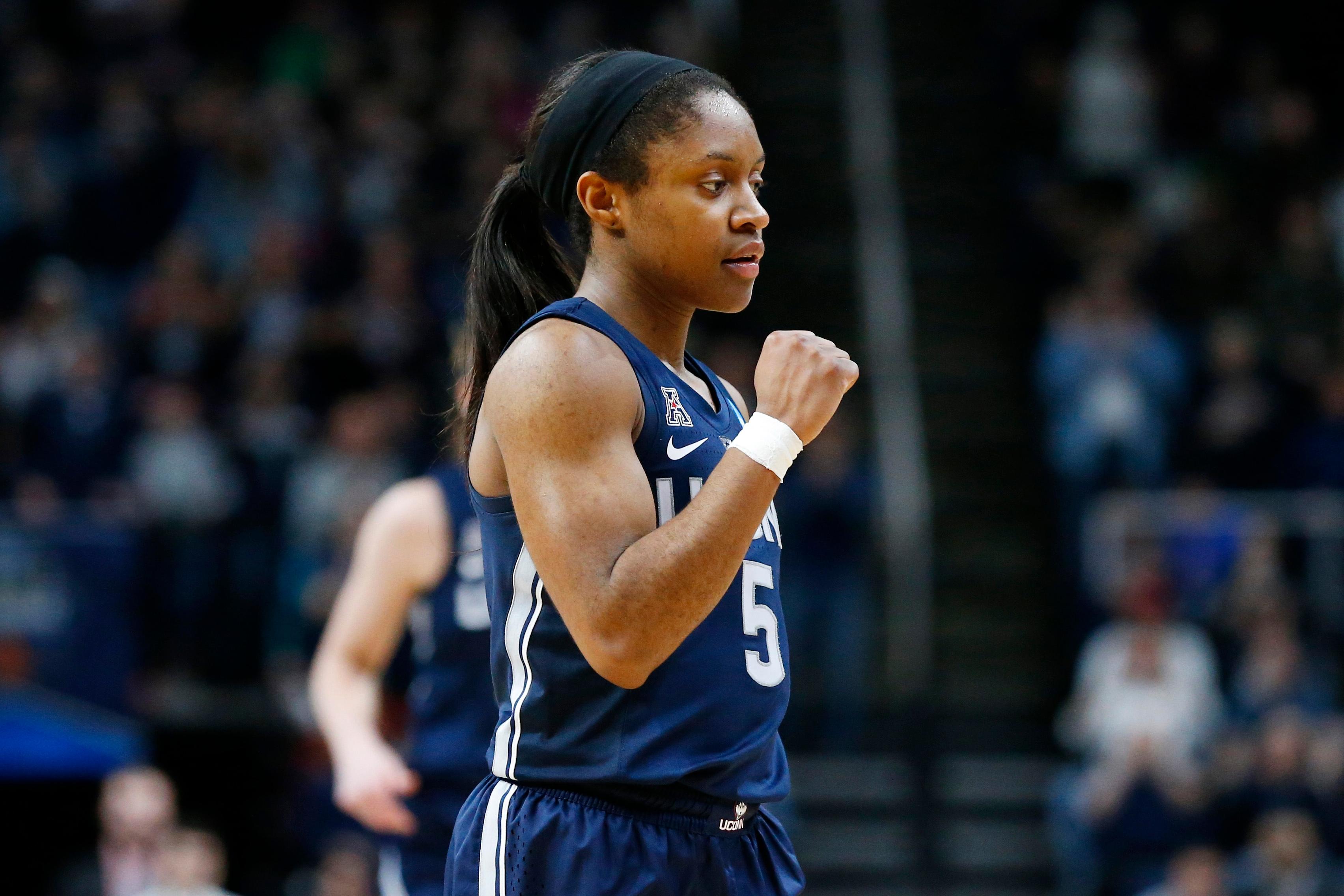 Mar 31, 2019; Albany , NY, USA; UConn Huskies guard Crystal Dangerfield (5) gestures during a time-out against the Louisville Cardinals during the second half in the championship game of the Albany regional in the women's 2019 NCAA Tournament at Times Union Center. Mandatory Credit: Rich Barnes-USA TODAY Sports