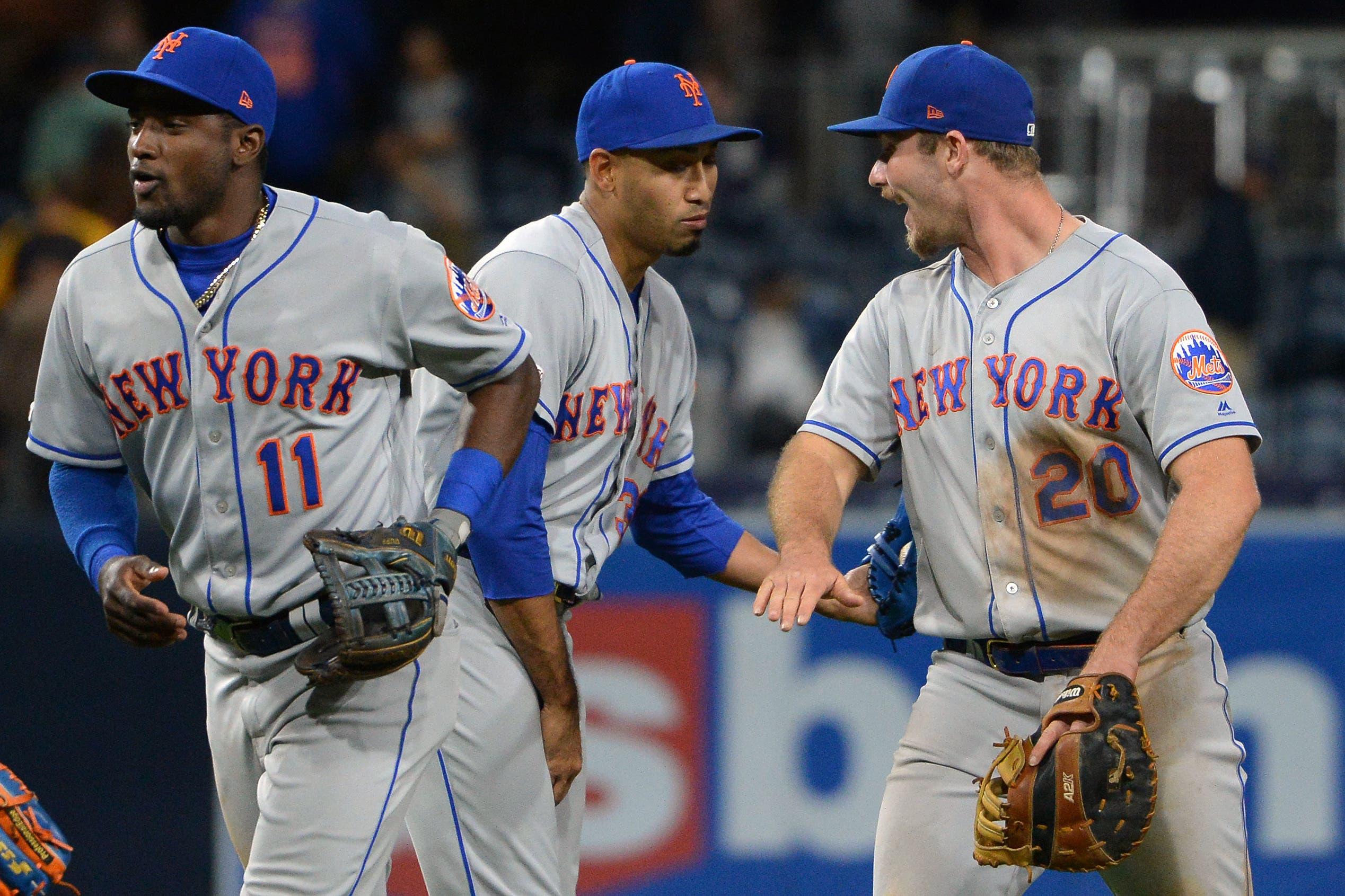 May 7, 2019; San Diego, CA, USA; New York Mets first baseman Pete Alonso (20) and shortstop Adeiny Hechavarria (11) and relief pitcher Edwin Diaz (middle) celebrate after defeating the San Diego Padres at Petco Park. Mandatory Credit: Jake Roth-USA TODAY Sports / Jake Roth