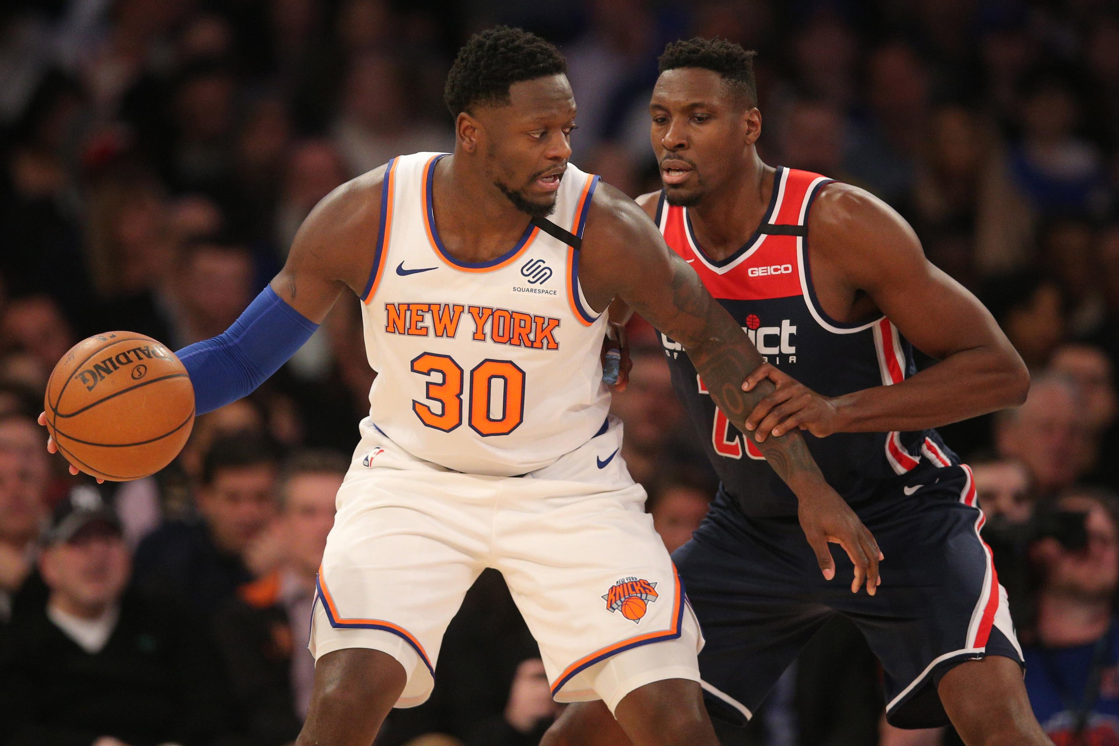 Feb 12, 2020; New York, New York, USA; New York Knicks power forward Julius Randle (30) controls the ball against Washington Wizards center Ian Mahinmi (28) during the second quarter at Madison Square Garden. Mandatory Credit: Brad Penner-USA TODAY Sports / Brad Penner