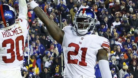 Dec 18, 2022; Landover, Maryland, USA; New York Giants cornerback Darnay Holmes (30) celebrates with Giants safety Landon Collins (21) after making a stop on fourth and goal against the Washington Commanders in the final minute of the fourth quarter at FedExField. Mandatory Credit: Geoff Burke-USA TODAY Sports