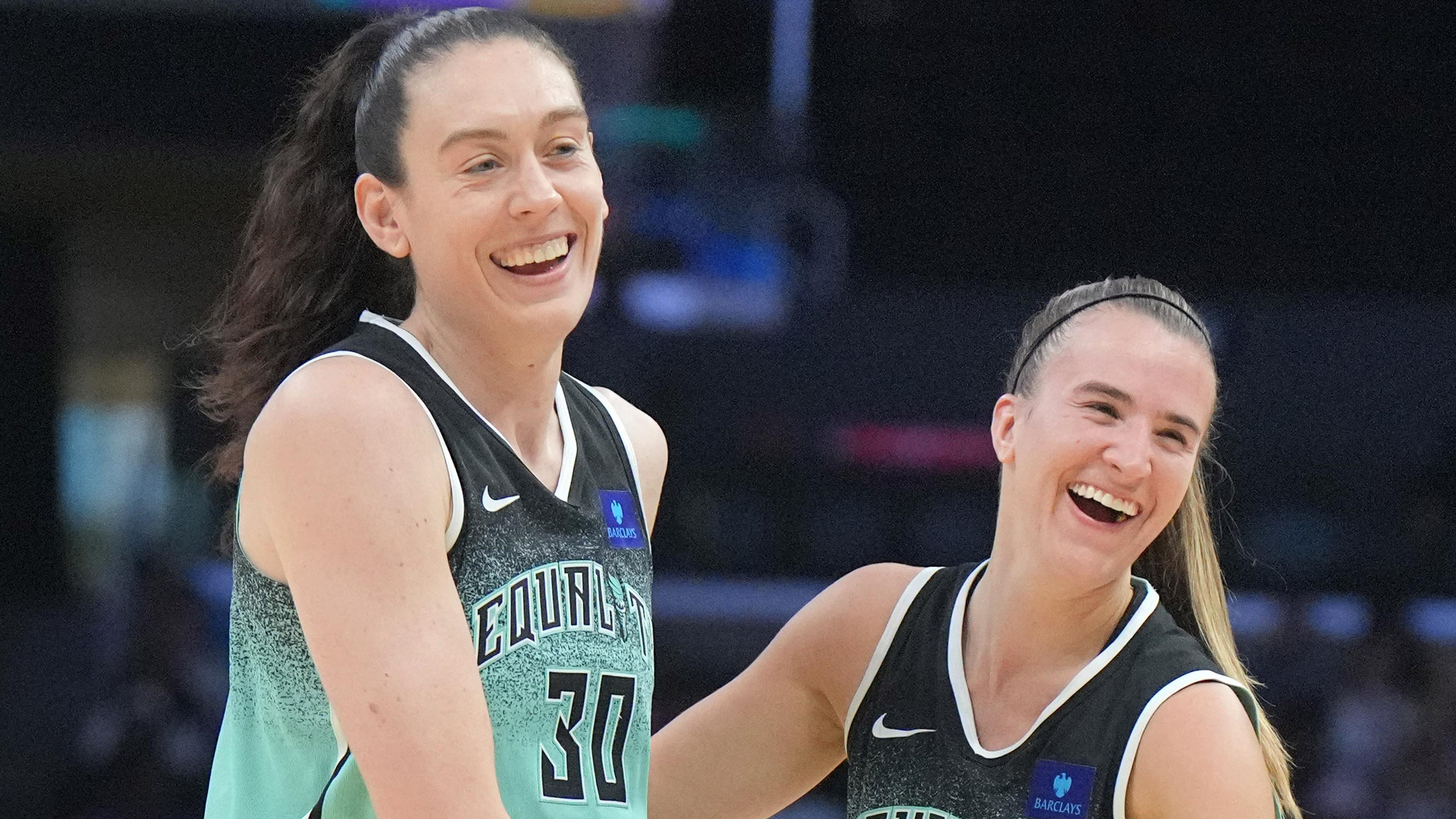 Aug 15, 2024; Los Angeles, California, USA; New York Liberty forward Breanna Stewart (30) and guard Sabrina Ionescu (20) celebrate in the first half against the LA Sparks Crypto.com Arena. Mandatory Credit: Kirby Lee-USA TODAY Sports / © Kirby Lee-USA TODAY Sports