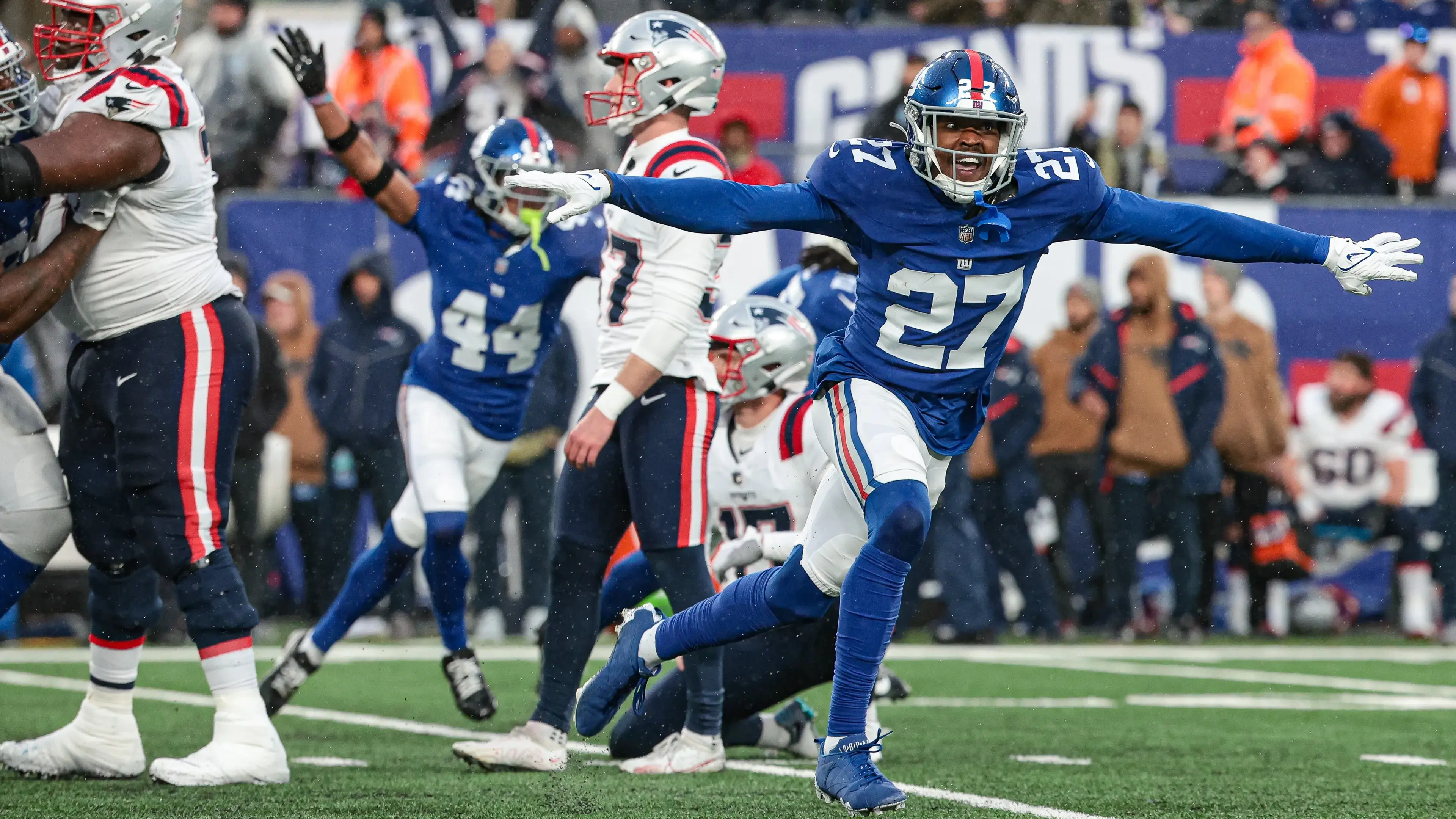 Nov 26, 2023; East Rutherford, New Jersey, USA; New York Giants safety Jason Pinnock (27) celebrates after New England Patriots place kicker Chad Ryland (37) misses a field goal during the fourth quarter at MetLife Stadium. Mandatory Credit: Vincent Carchietta-USA TODAY Sports / © Vincent Carchietta-USA TODAY Sports